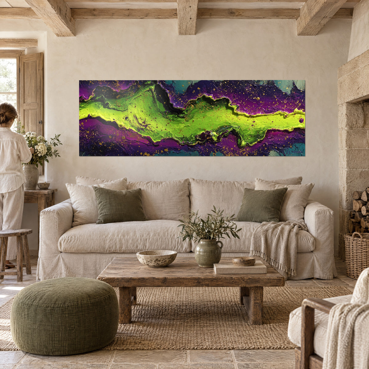 Wall art with acid green flowing pour edged in purple, golden splashes, hanging above a sofa in a bright living room