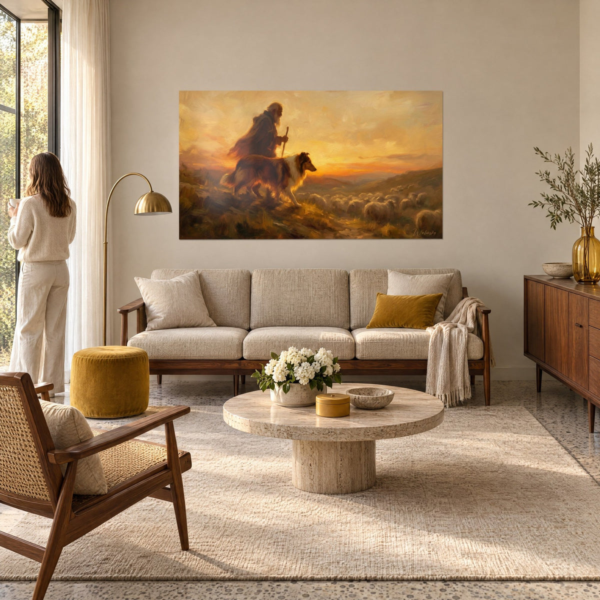 Wall art old bearded shepherd with a staff, draped in brown, under an orange and golden sky, above a sofa in a bright living room