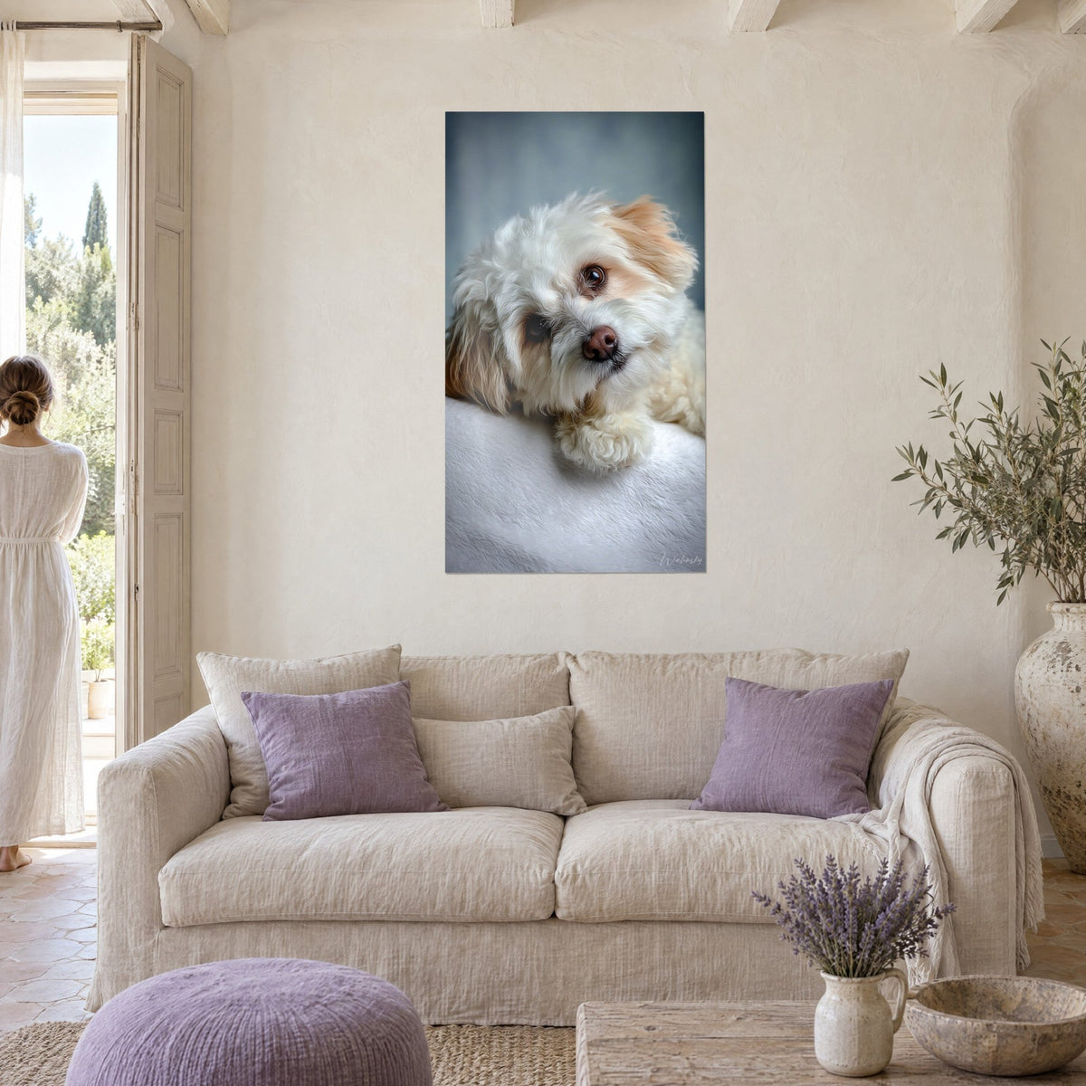 Wall art Havanese dog with head tilted, cream and red fur, blue-grey background, above a sofa in a bright living room