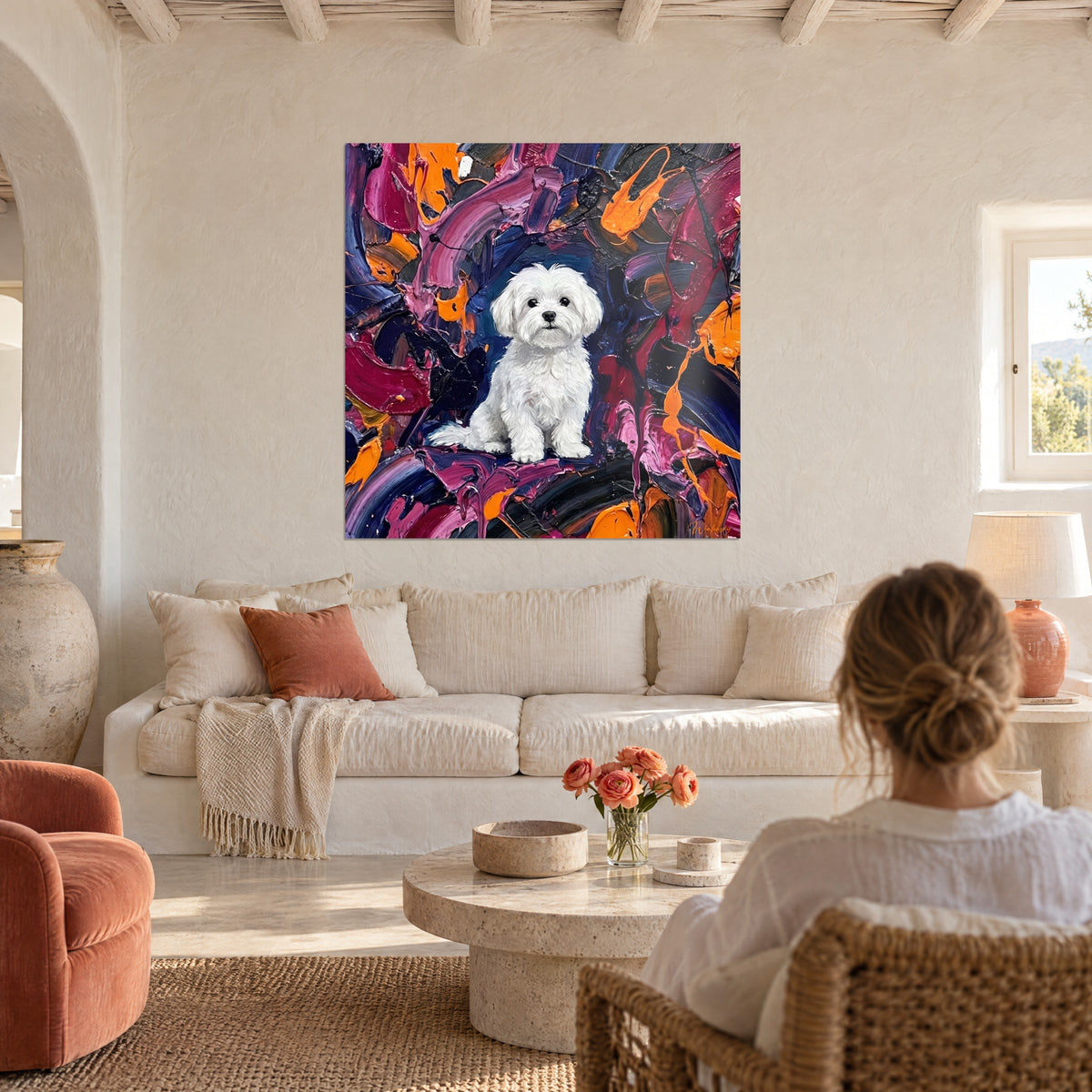 Wall art fluffy white Maltese dog sitting on a background of magenta, midnight blue and orange streaks, above a sofa in a bright living room