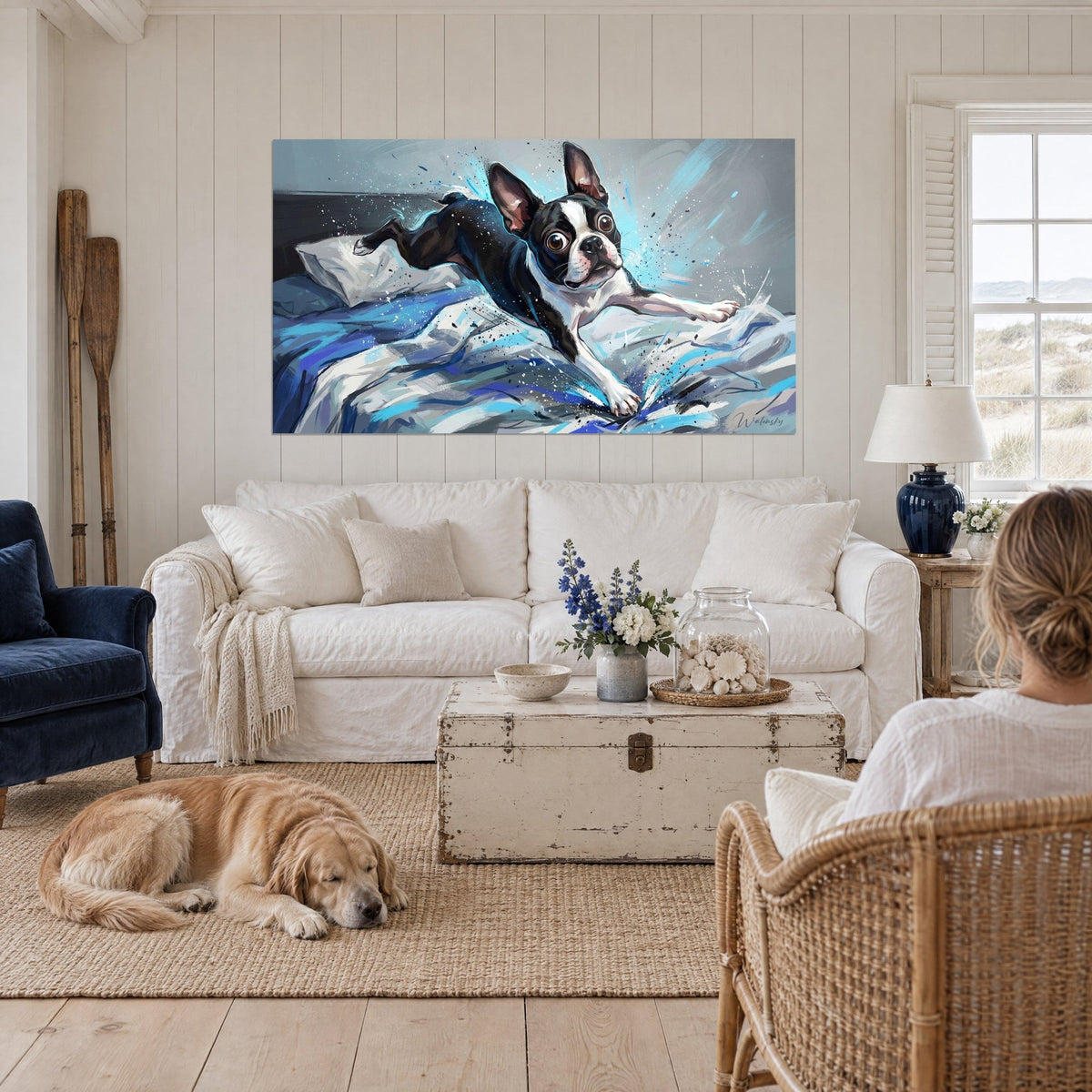 Wall art of a leaping Boston Terrier, black and white coat, sky blue splashes, above a sofa in a bright living room