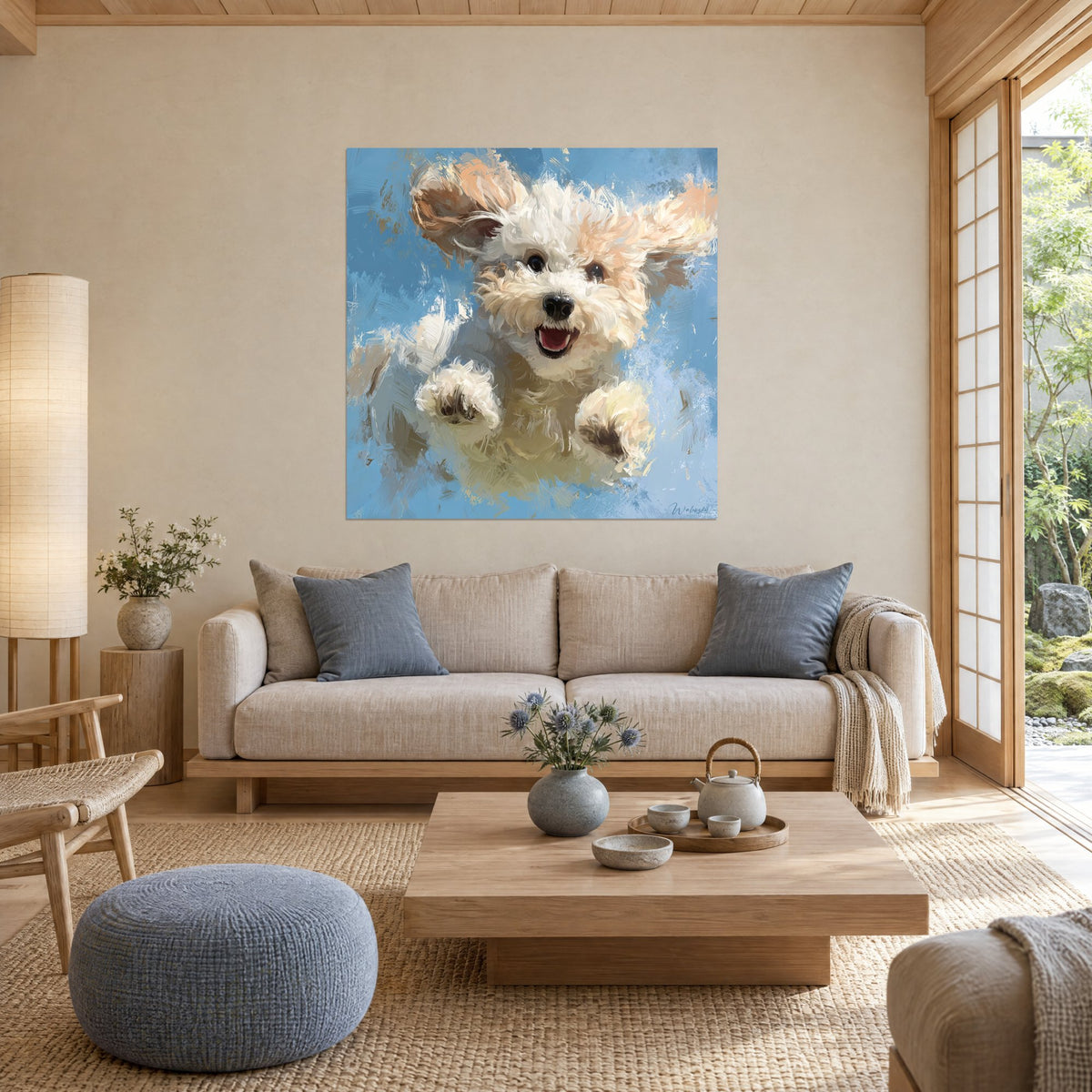 Wall art of a curly puppy in cream and peach leaping on a sky blue background, black muzzle and pink mouth, above a sofa in a bright living room