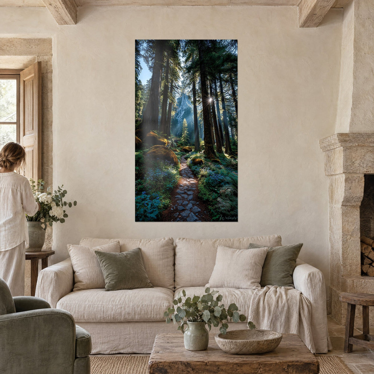 Wall art flat stone path through a redwood forest, ochre moss and blue flowers, above a sofa in a bright living room