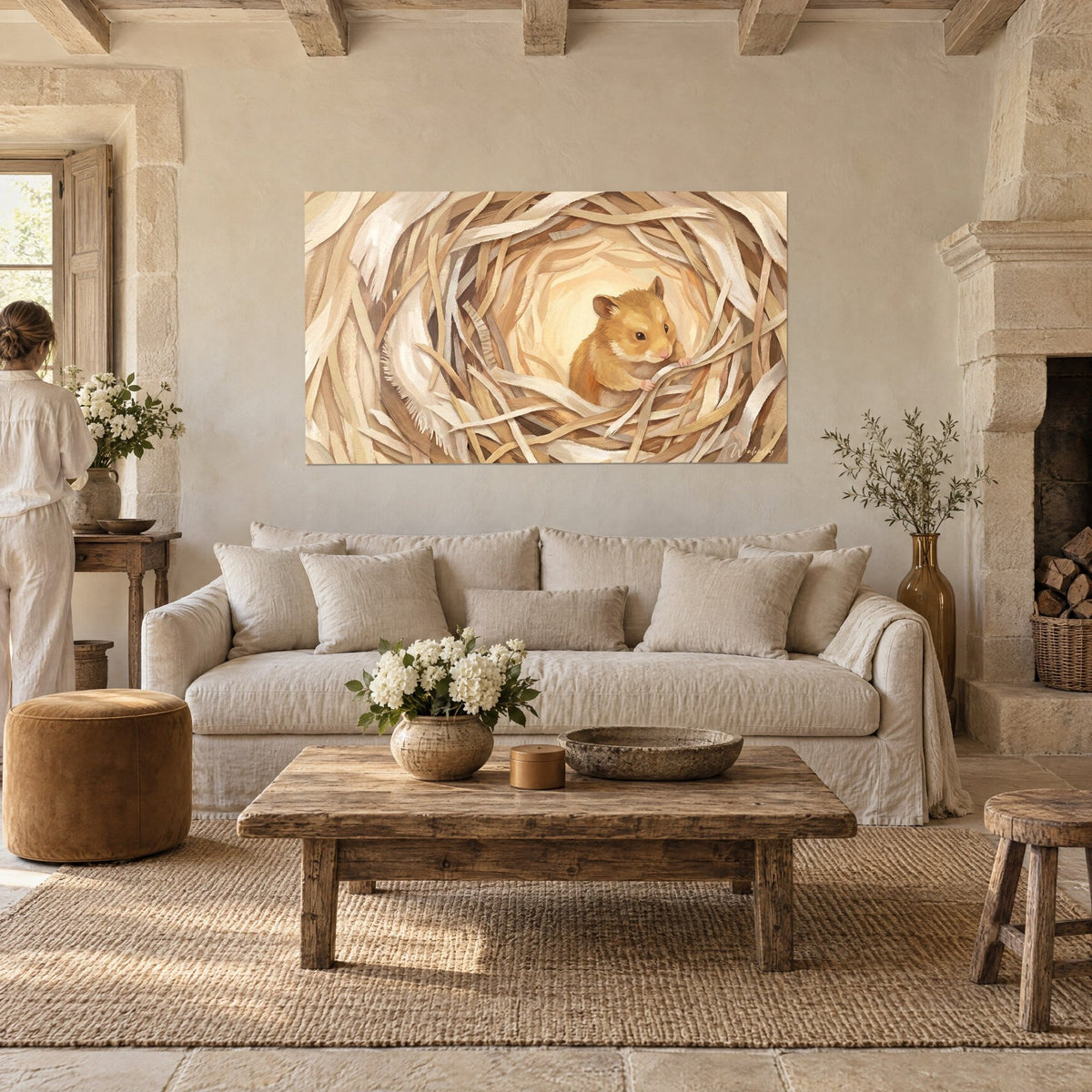 Wall art of a golden hamster curled up in a nest of ivory and beige wood shavings, hanging above a sofa in a bright living room