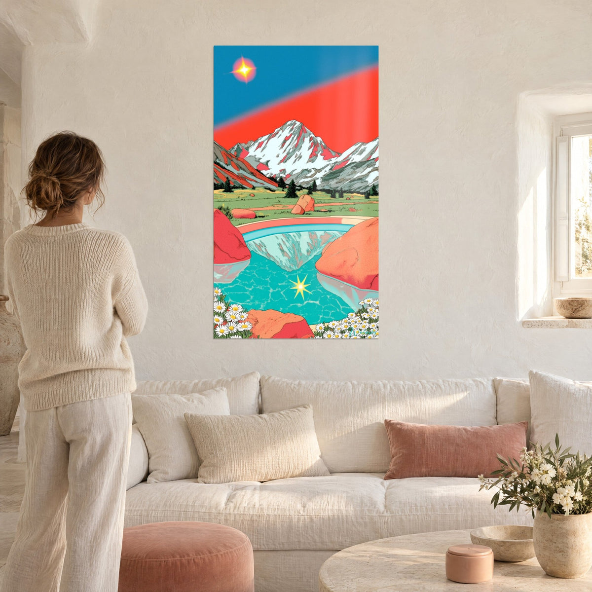 Tableau sommet enneigé au ciel rouge vif, lac turquoise et marguerites, au-dessus d'un canapé dans un salon lumineux