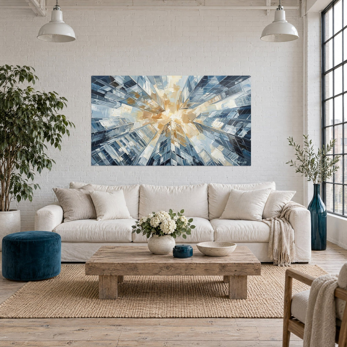 Wall art skyscrapers seen from below, ochre and steel-blue palette knife strokes, above a sofa in a bright living room