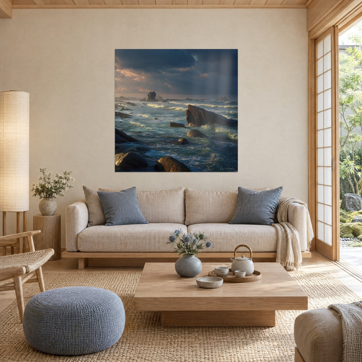 Wall art Breton reef under storm, brown rocks and green sea with white-capped waves, above a sofa in a bright living room