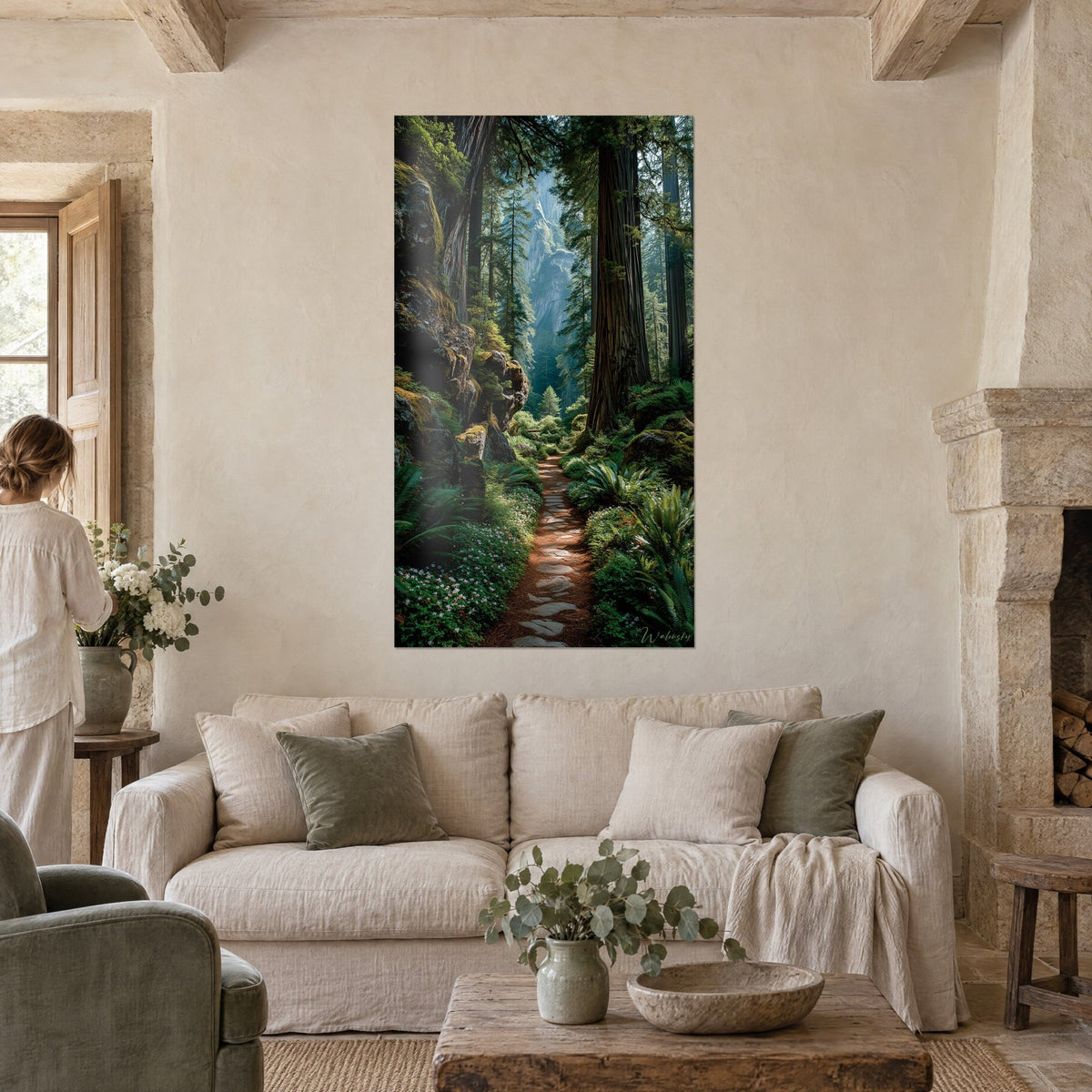 Wall art flat stone path between giant redwoods, emerald ferns and ochre moss, above a sofa in a bright living room