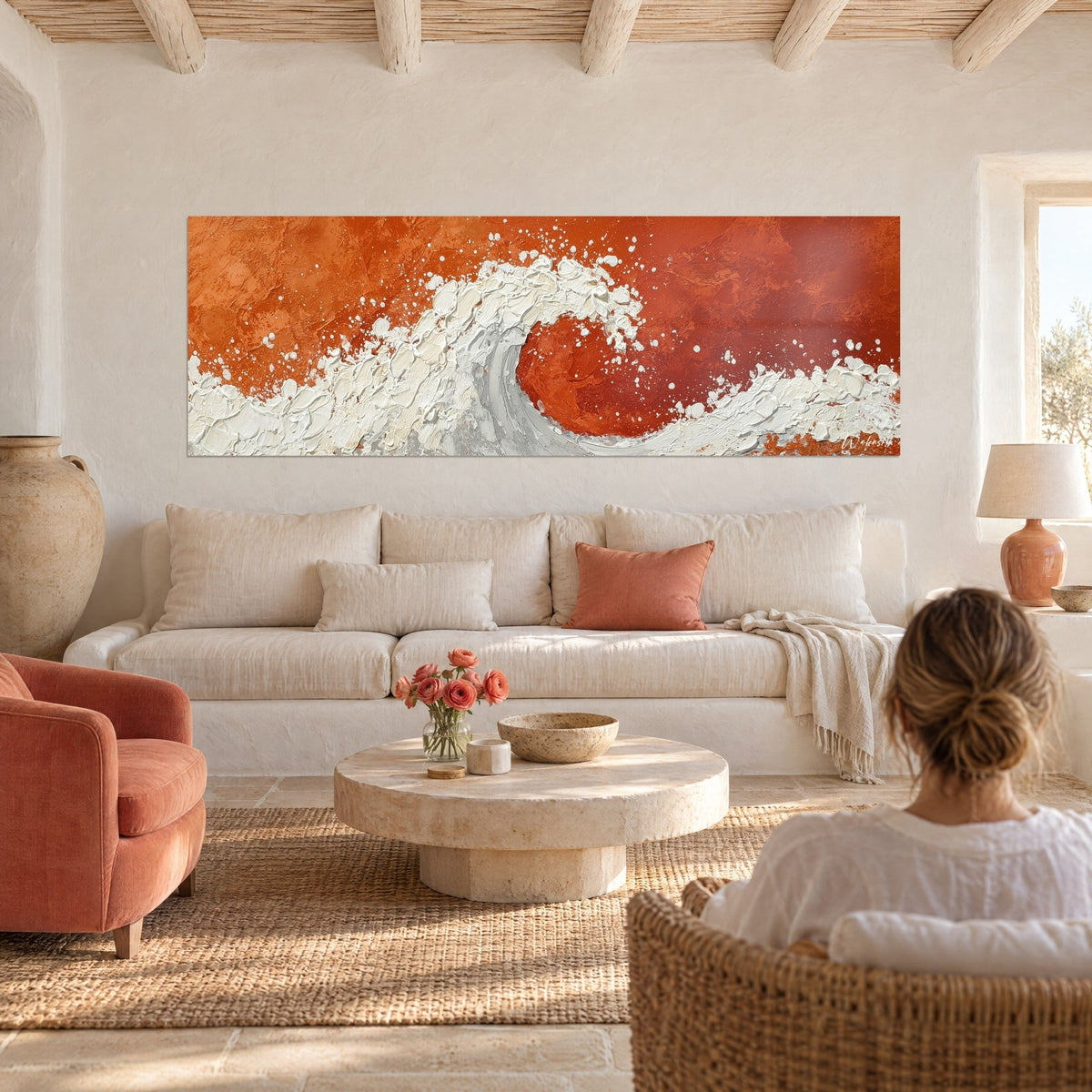 Wall art ivory foam wave in relief on a Sienna red earth background, above a sofa in a bright living room