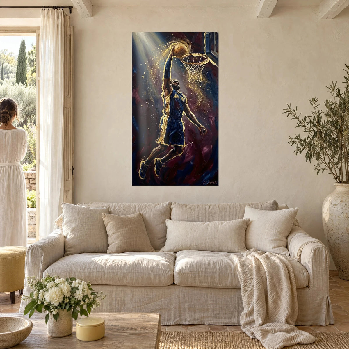Wall art basketball player mid-dunk, navy jersey with gold trim, above a sofa in a bright living room