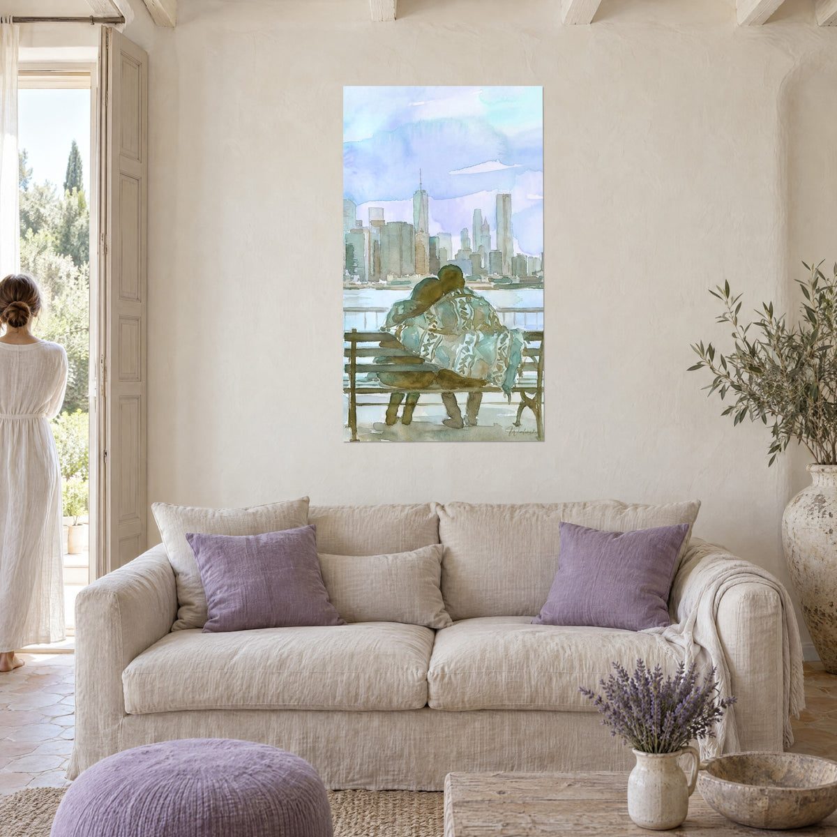 Wall art of a couple embracing on a bench facing skyscrapers, lavender blue and verdigris, woman seen from behind, above a sofa in a bright living room