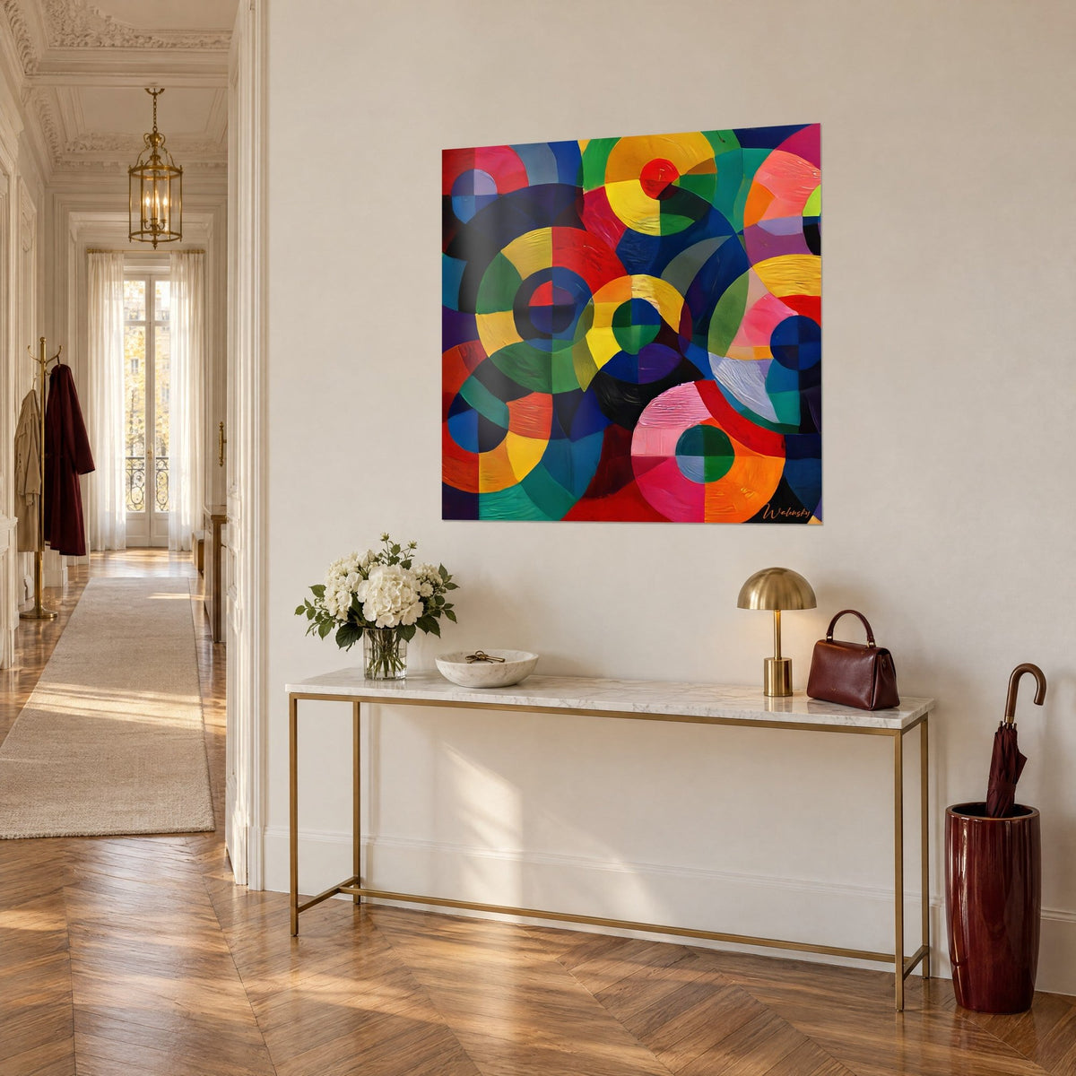Wall art of abstract checkered discs in emerald green and orange on royal blue, seen at three-quarter angle above a gilded console