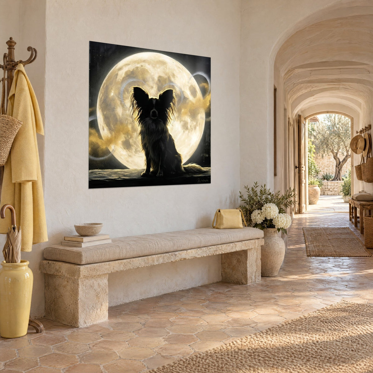 Wall art small dog with large black ears cut out against a cream and ochre moon disc, grey swirls, three-quarter view in a vaulted hallway