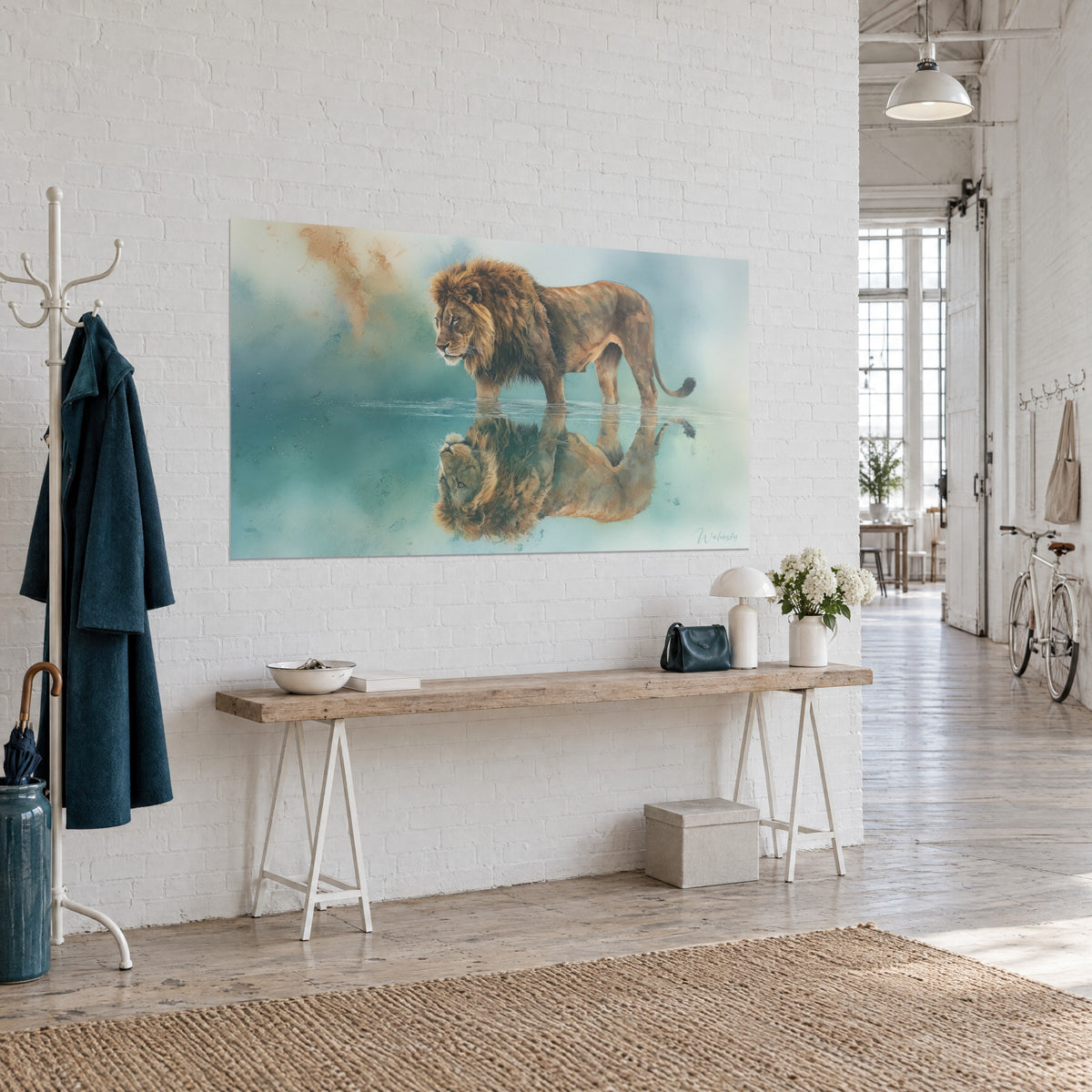 Wall art of a massive big cat with an amber mane and mirror reflection, blue-green watercolour with touches of orange sand, three-quarter view on a white brick wall