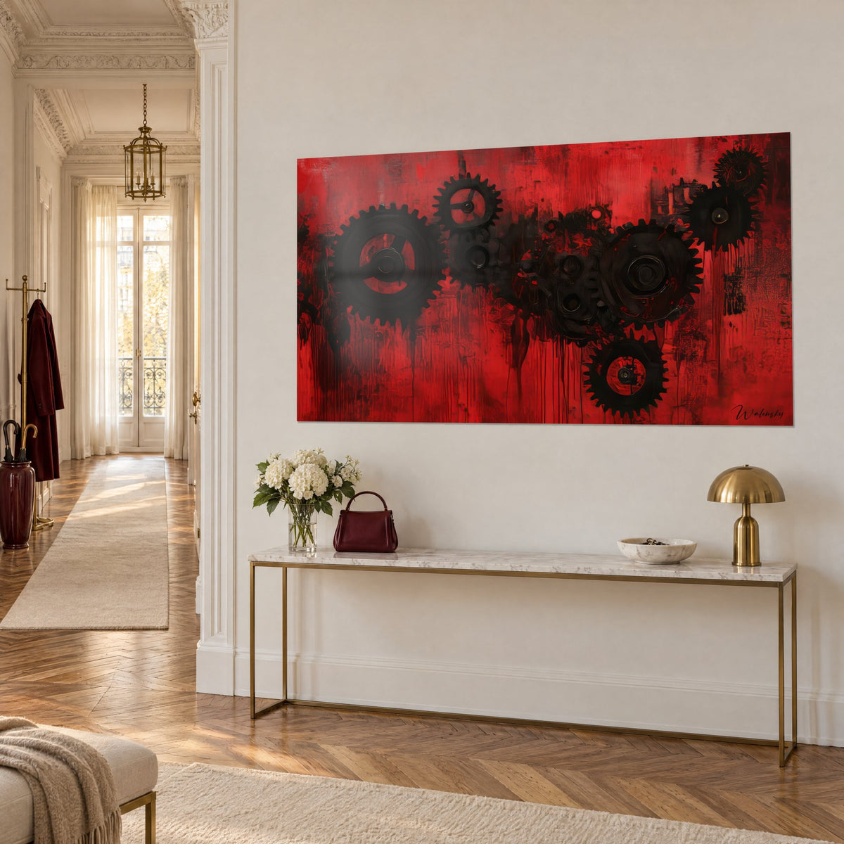Wall art with dark gear mechanism on blood red, paint splatters, above a gilded console and white marble