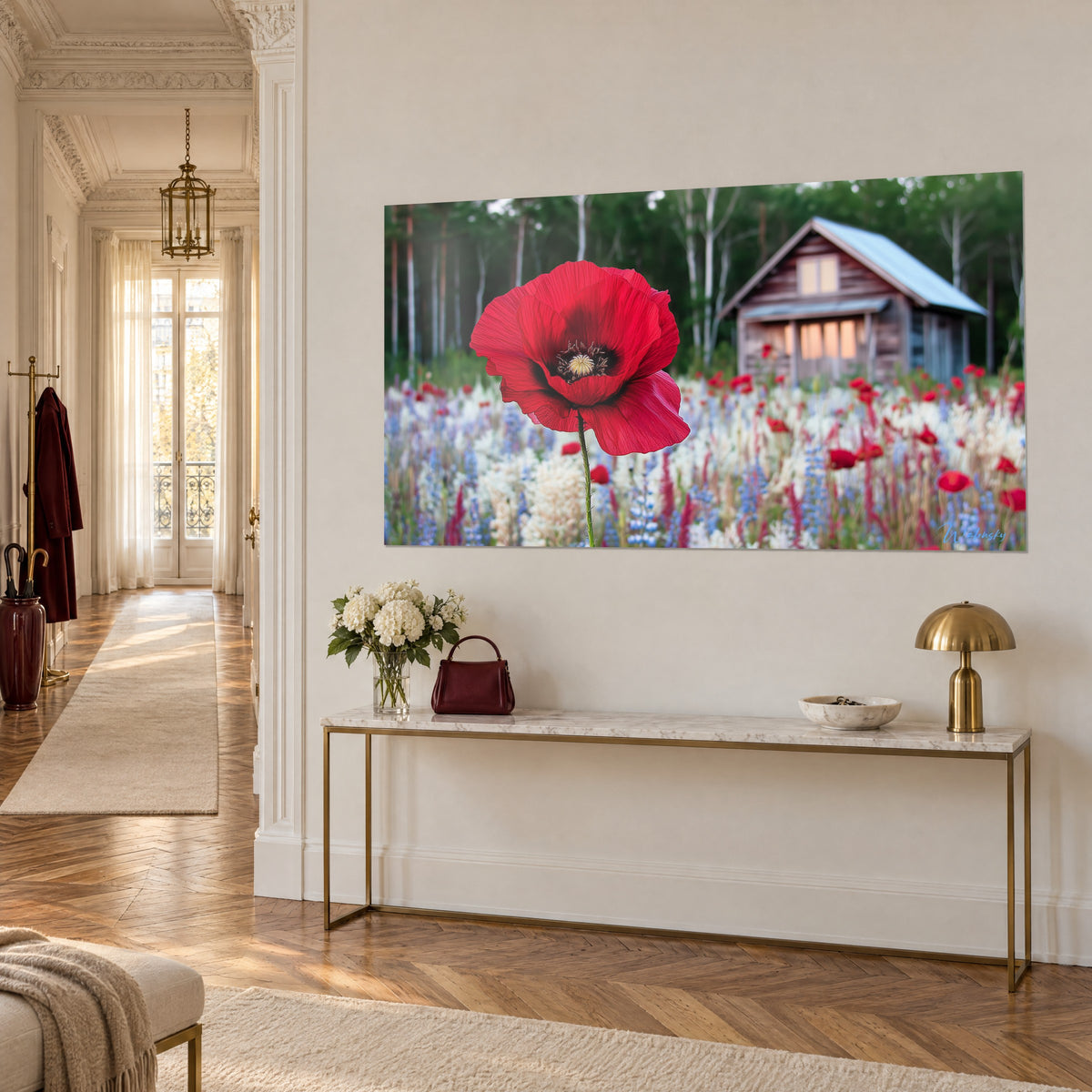 Wall art of an amber wood chalet nestled among birches, large scarlet flower in the foreground, three-quarter view of a gilded console and cream wall