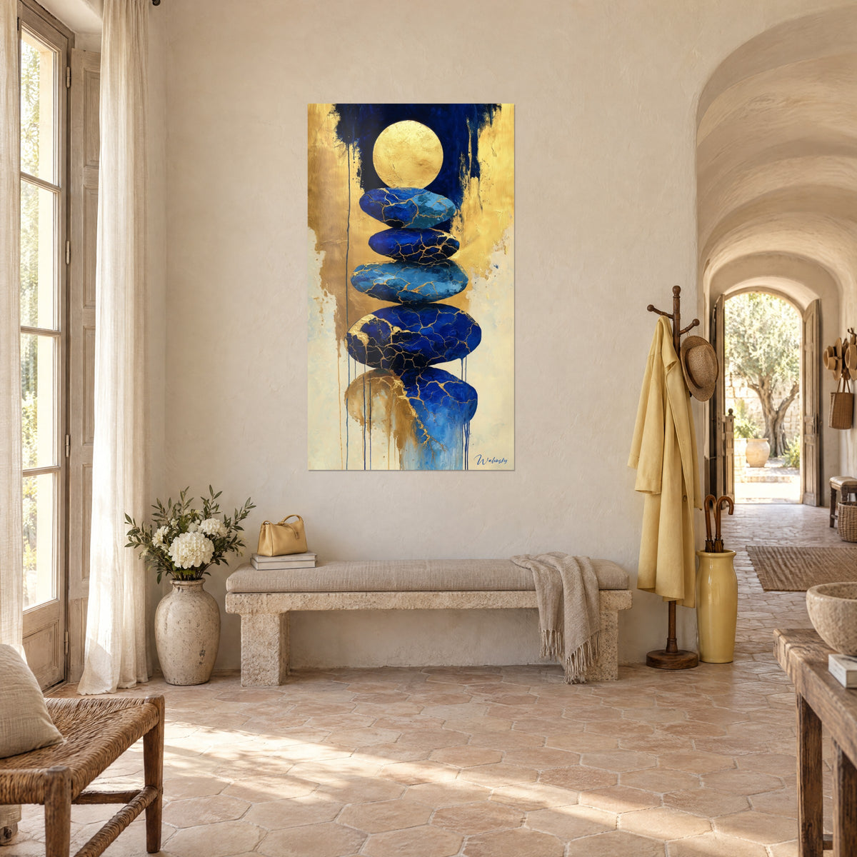 Wall art of an indigo stone cairn veined with gold and a golden moon disc on a cream background, in the entrance hall of a Provençal farmhouse
