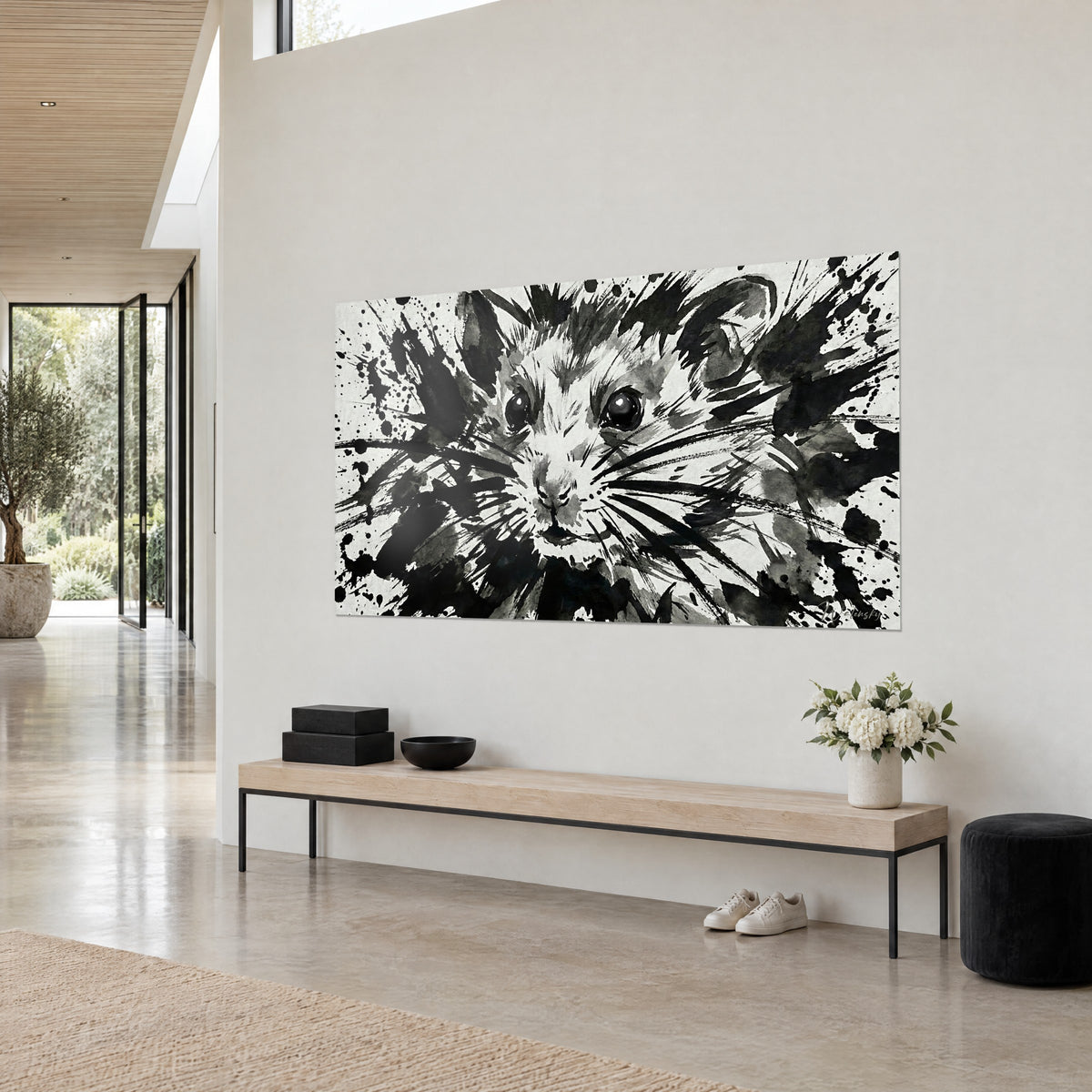 Wall art rodent in black and white wash, bristling fur around the muzzle, grey splashes on a light wall, wooden bench