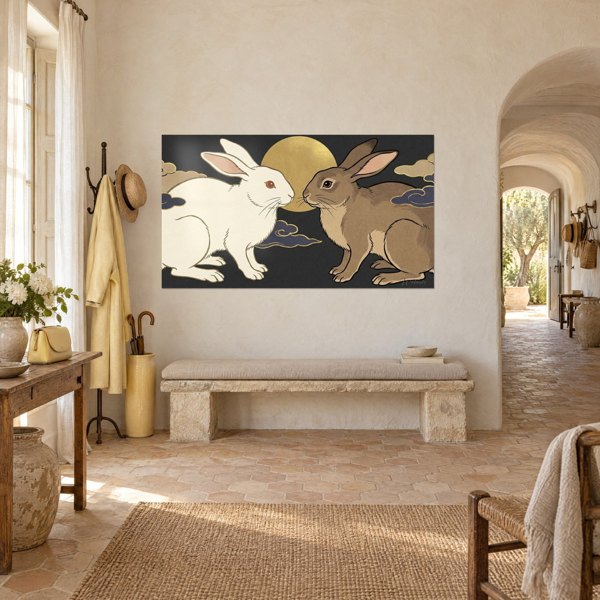 Wall art pair of cream and taupe hares before a golden disc on a black background, indigo clouds, Provençal farmhouse seen three-quarter view