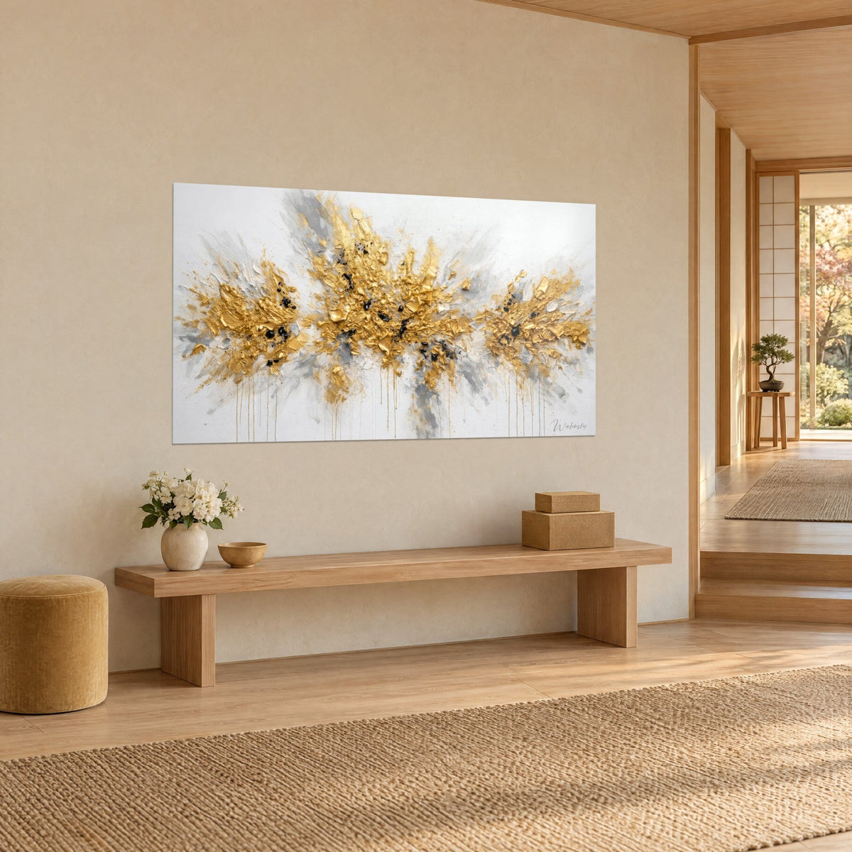 Wall art with a splash of gold paint and glossy thick impasto, pearl grey clouds and black drops, three-quarter view, on a beige wall