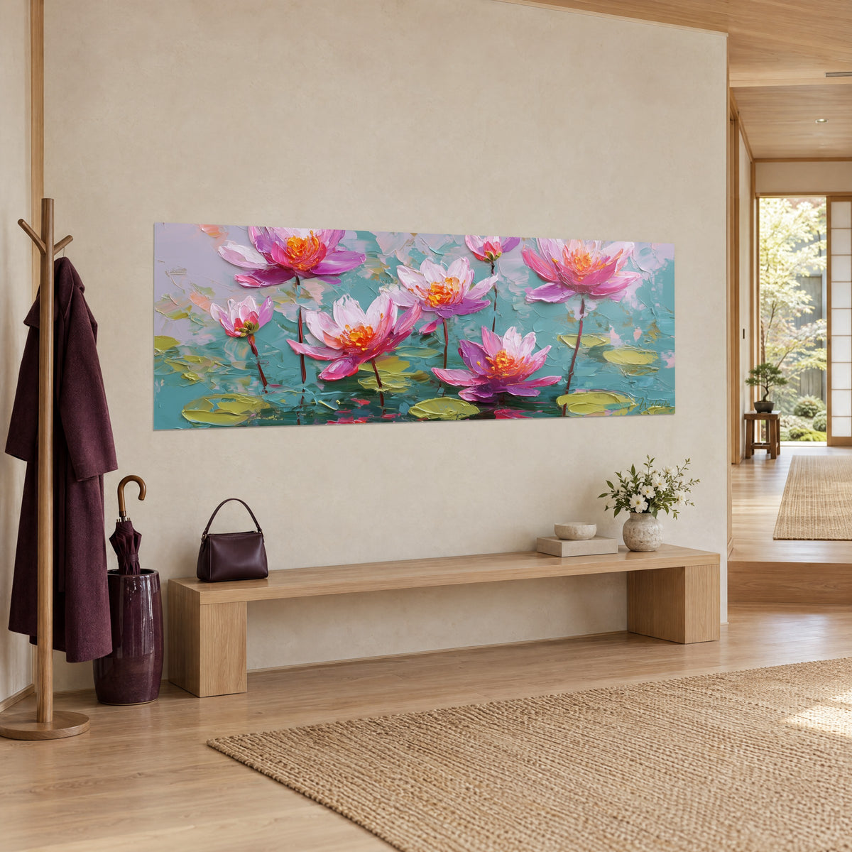 Wall art of mauve and pale pink lotus flowers, olive green leaves on a blue-green background, three-quarter view on a cream wall