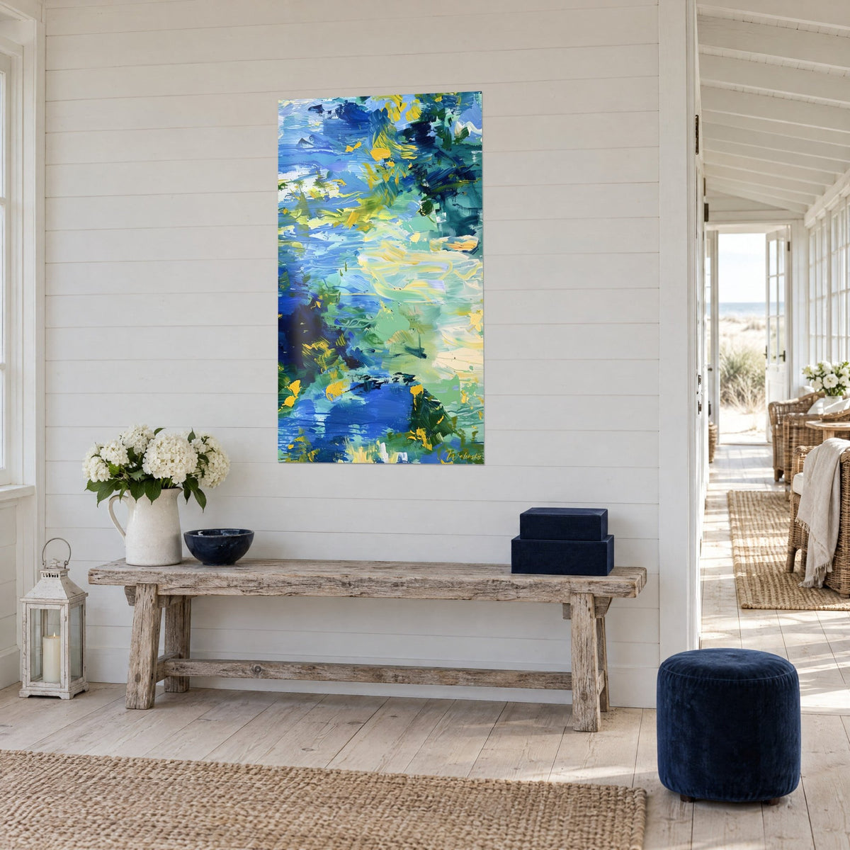 Wall art with a vibrant water surface, ultramarine and mint green streaked with yellow, on a paneled wall, seaside