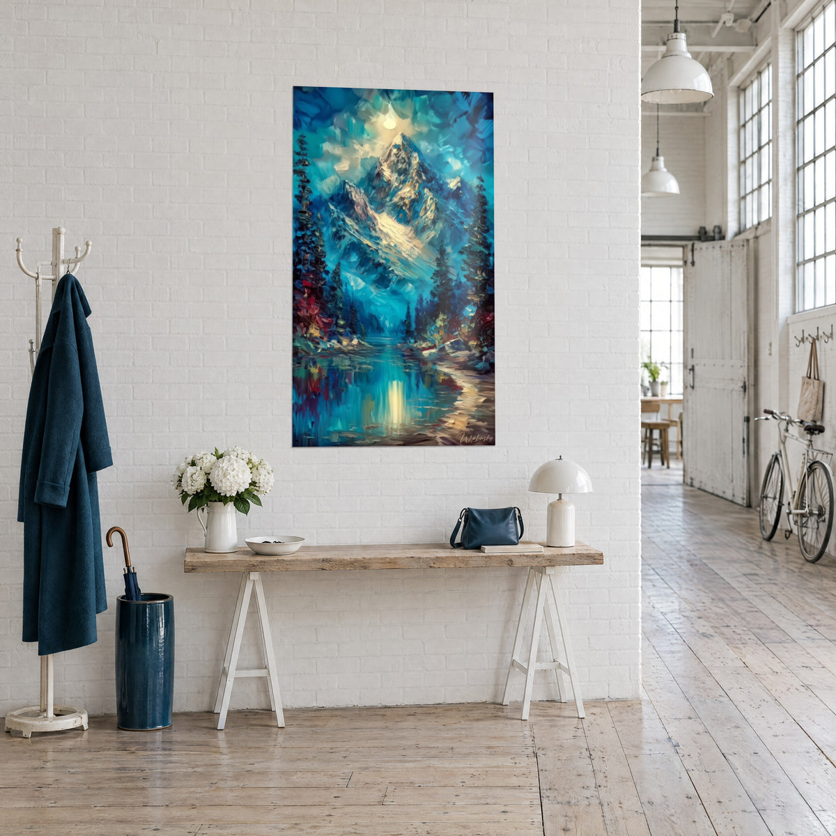 Wall art alpine summit bathed in pale moonlight, midnight blue sky, red shores and mirror-like lake, shown at a three-quarter angle on a white brick wall