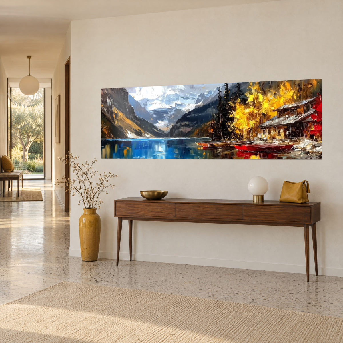 Cuadro panorama de montañas nevadas, chalet de madera y follaje dorado reflejados en el agua azul, vista de tres cuartos sobre una consola de madera
