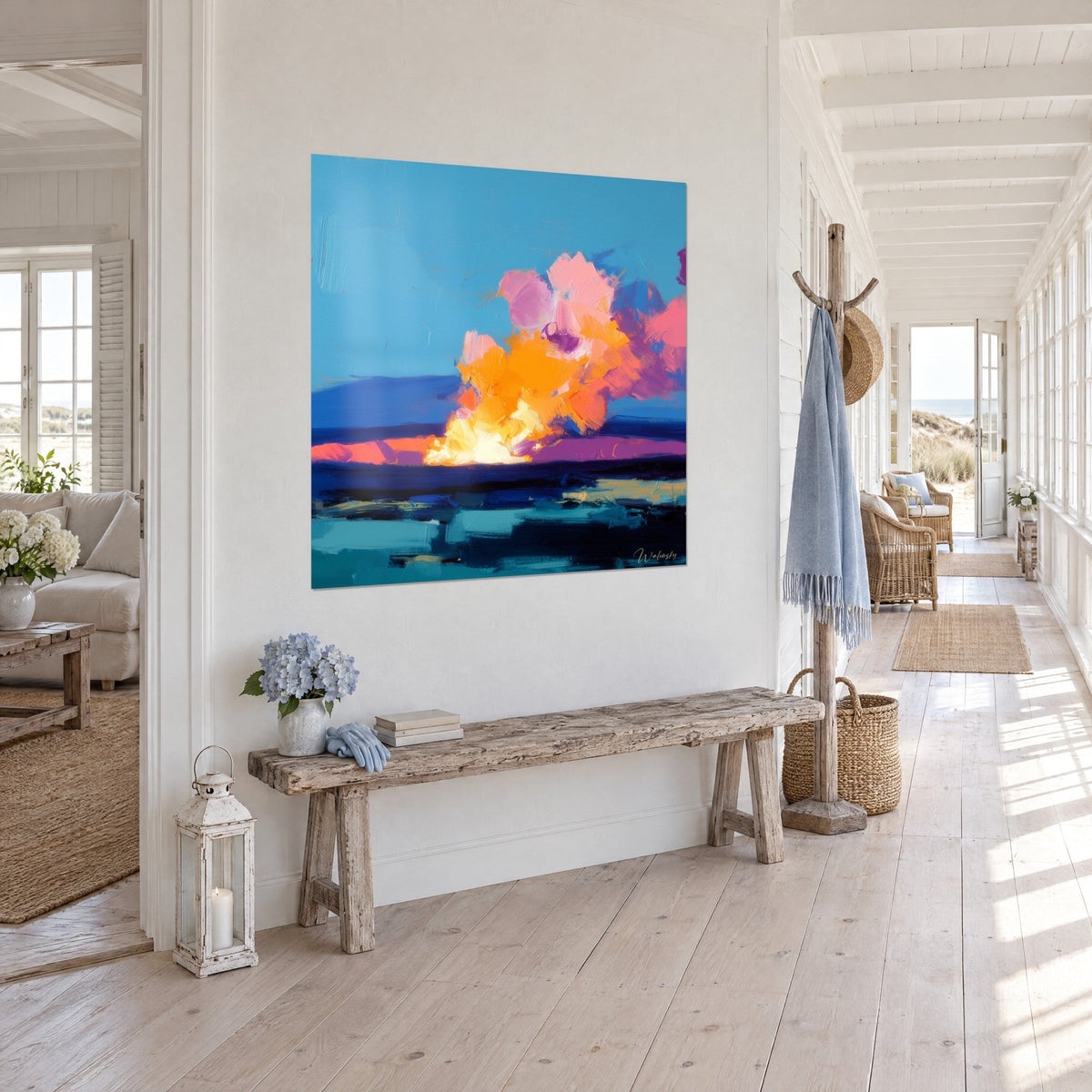 Wall art glowing cloud in yellow and mauve over an indigo sea, three-quarter view, near a wooden bench in the bright entryway