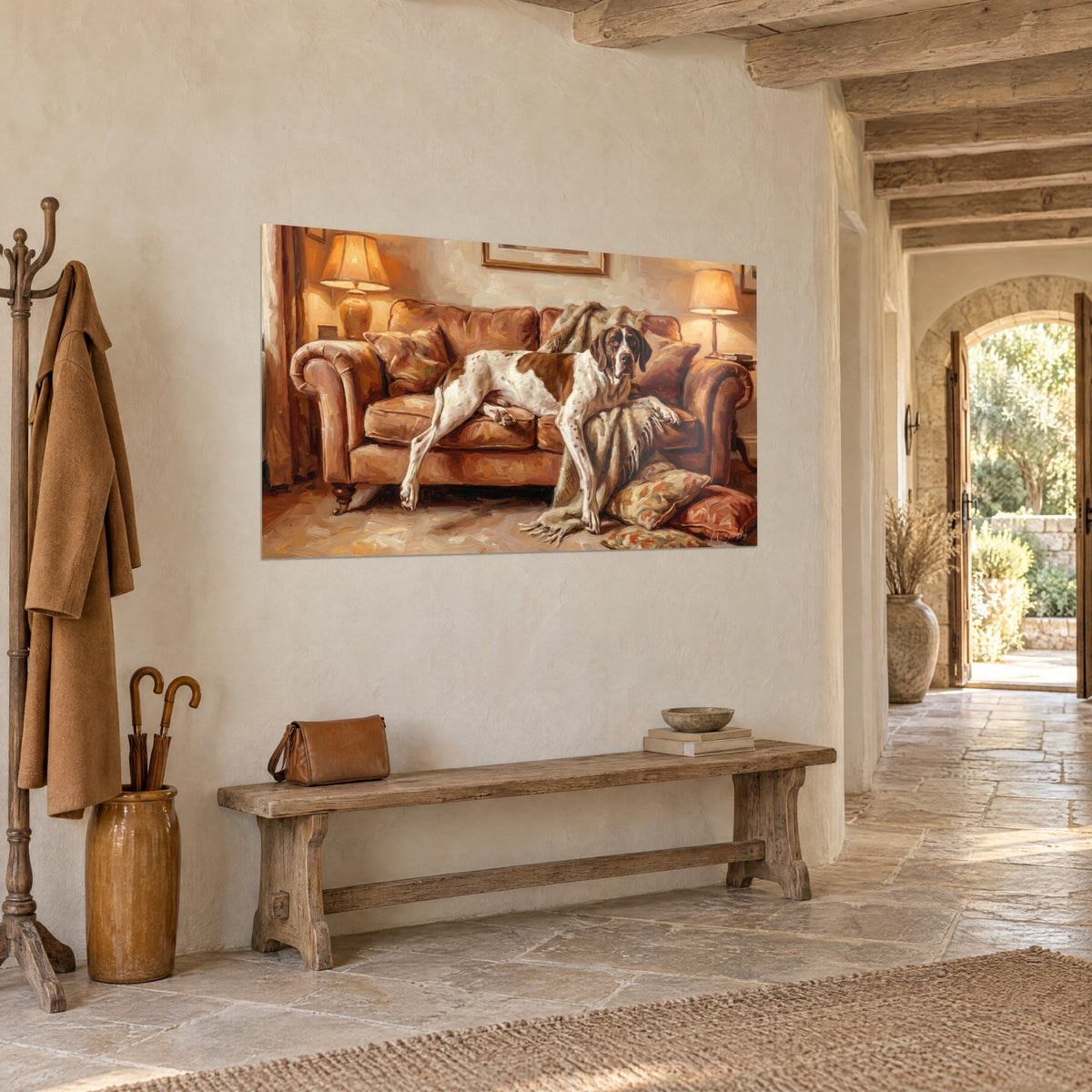 Tableau chien de chasse tacheté étendu sur des coussins fleuris et un plaid beige, accroché en trois-quarts dans un hall en pierre