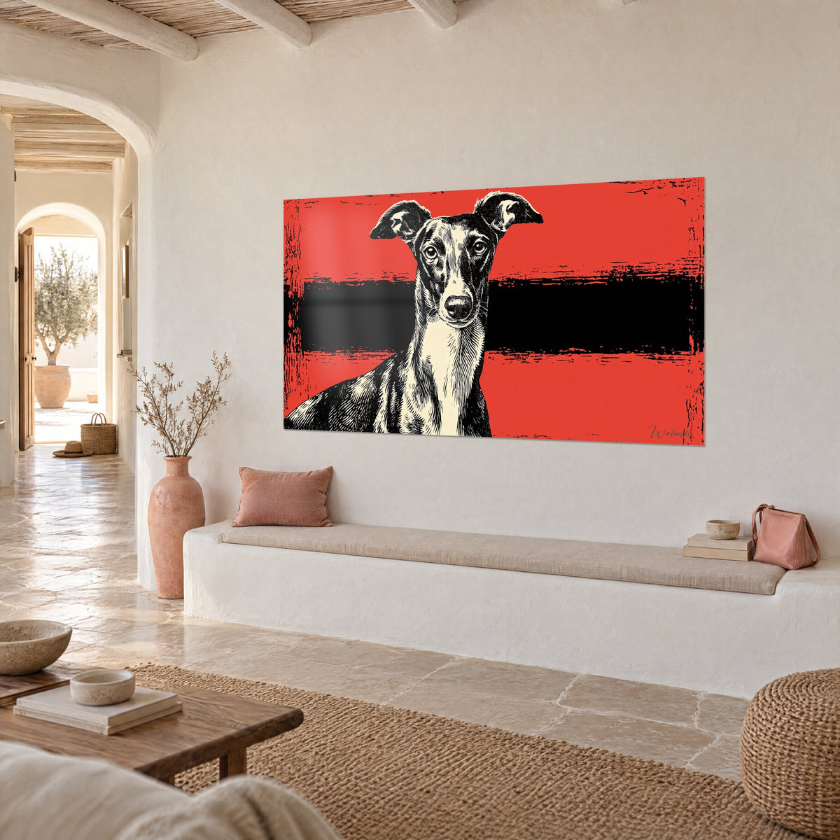 Tableau portrait de chien élancé, oreilles dressées, gravure noir et crème sur rouge, mur blanc d'une maison méditerranéenne