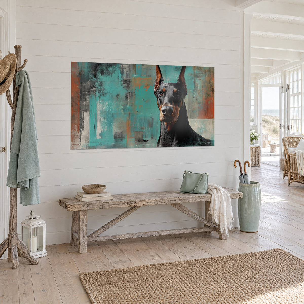 Cuadro perro de raza con mirada penetrante, hocico gris y pecho negro, fondo turquesa y naranja, en una habitación luminosa de madera blanqueada