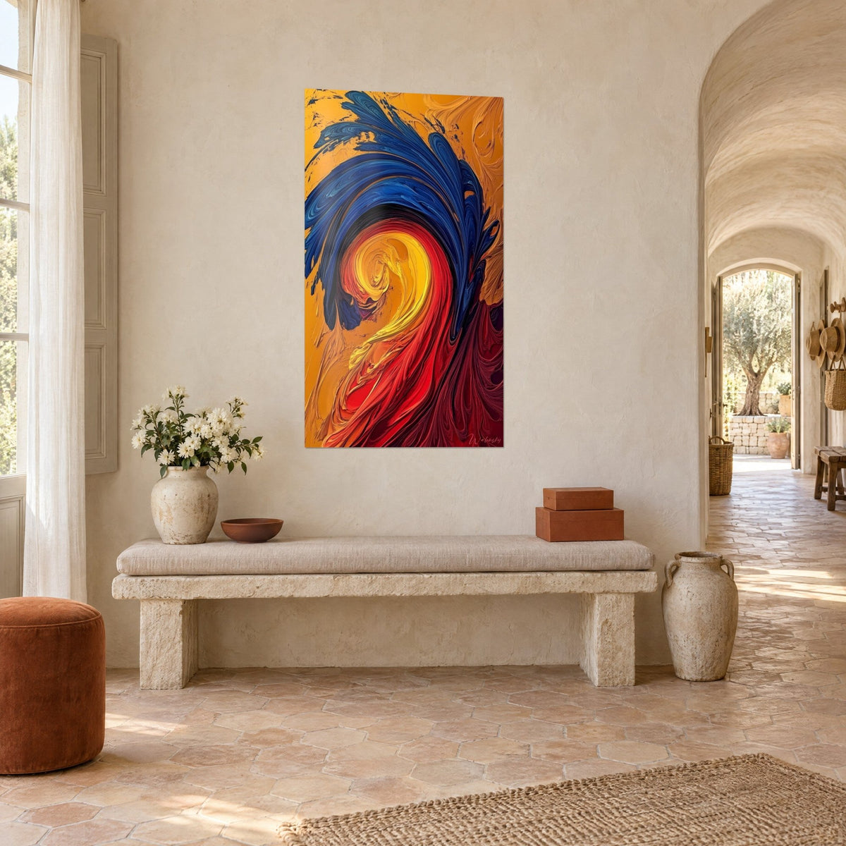 Wall art swirl of thick orange, navy blue and purple paint, hung on the plastered wall of a vaulted stone hallway