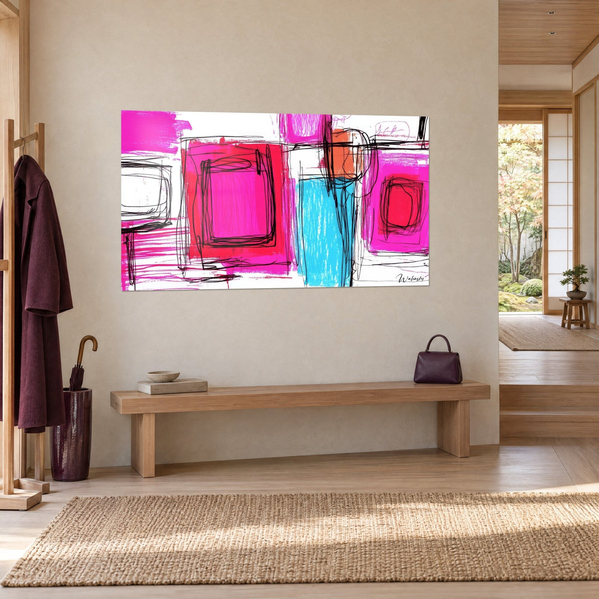 Wall art geometric composition with flat magenta areas, a turquoise blue band and an orange square, three-quarter view in a bright entryway