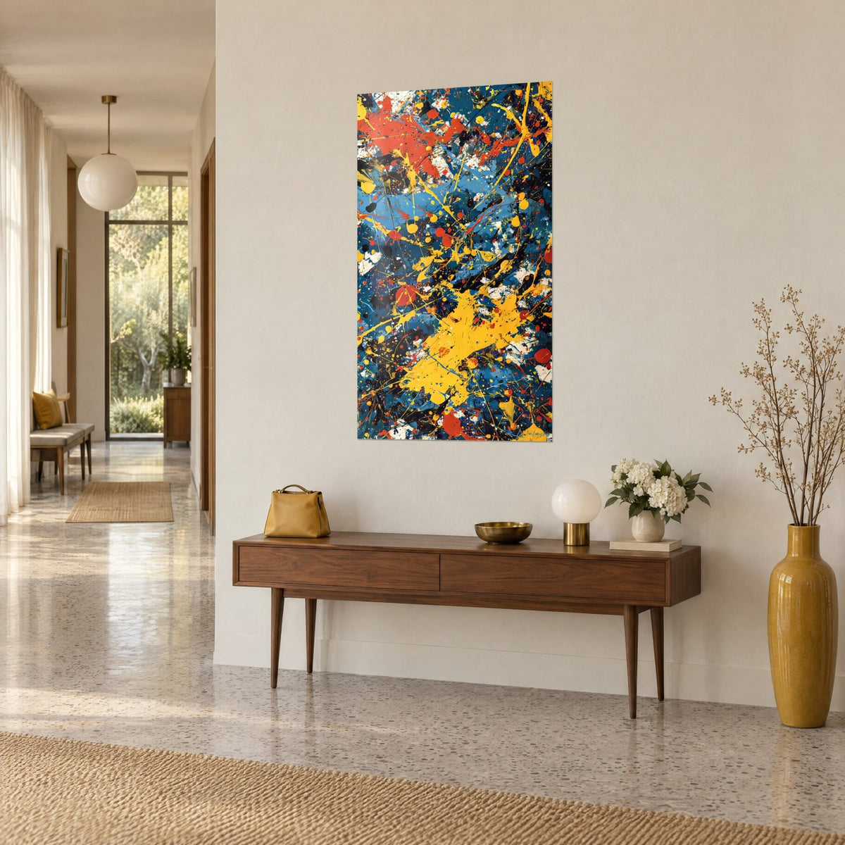 Wall art abstract canvas in drip style, black drops and a vivid yellow patch on blue background, three-quarter view in a sunlit hallway
