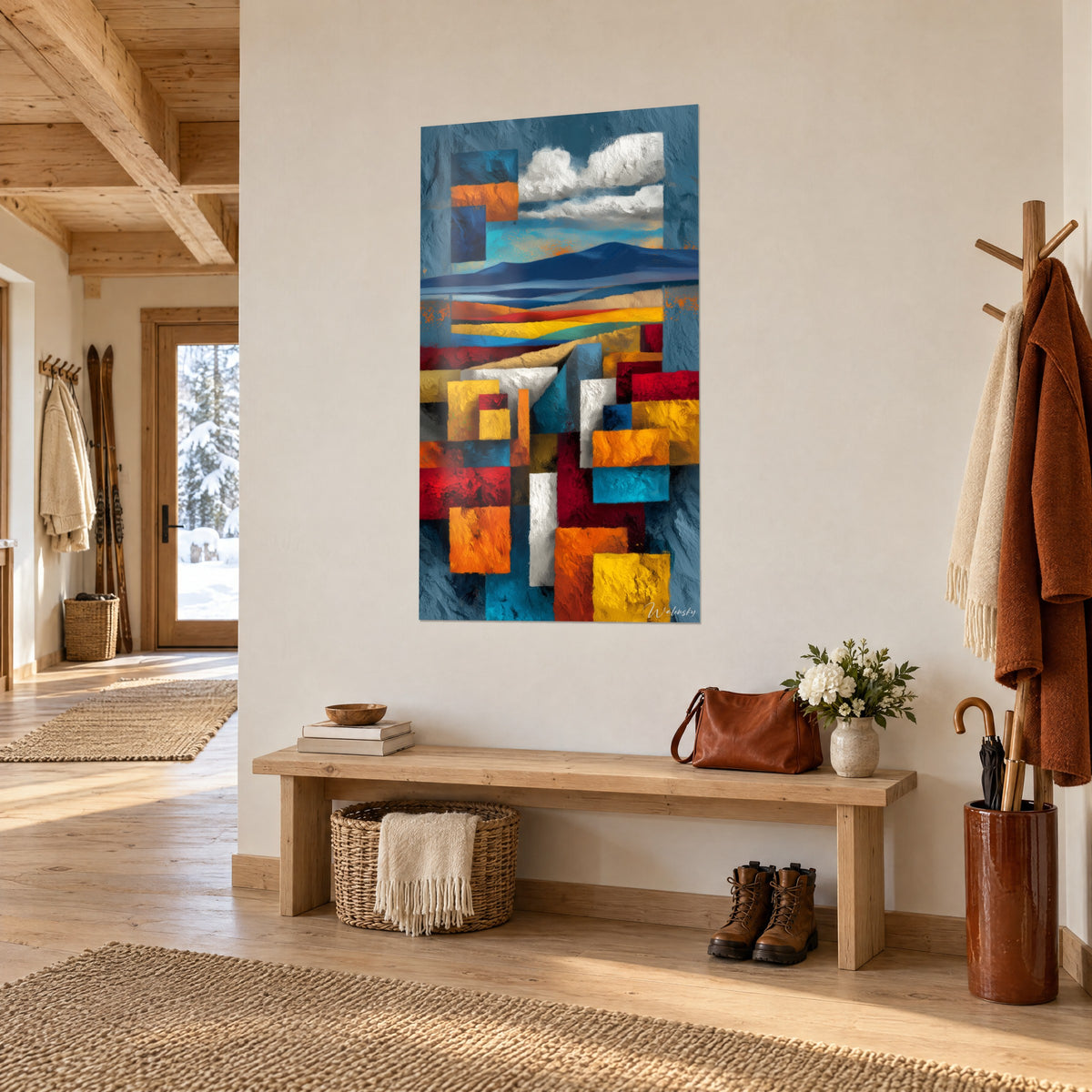 Gemälde einer Wüstenlandschaft in geometrischen Flächen aus Petrolblau und Ocker, weiße Wolken, im Eingang eines Chalets mit hellem Holz