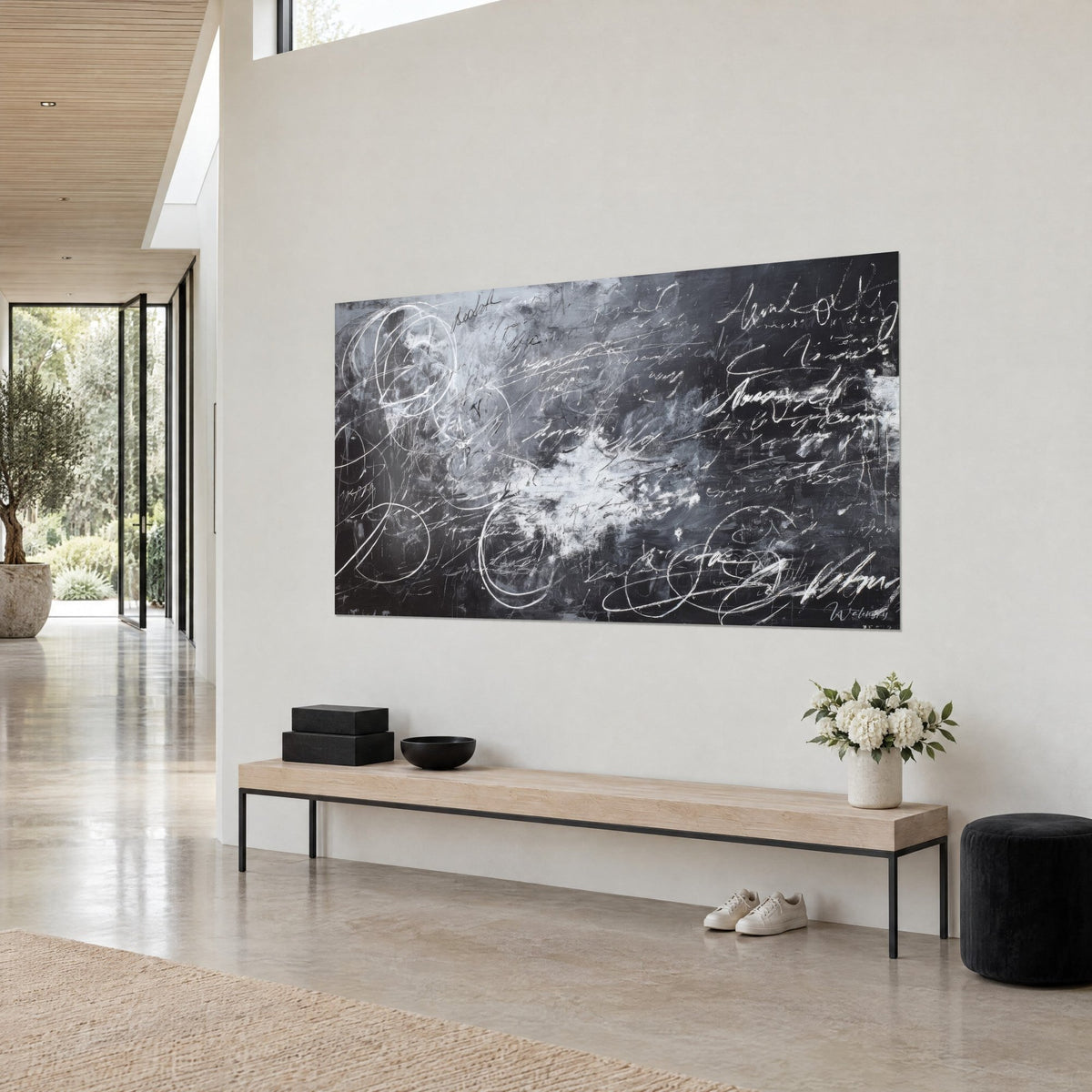 Wall art mysterious writings with white spirals, central chalk cloud on charcoal background, three-quarter view in an architect's living space
