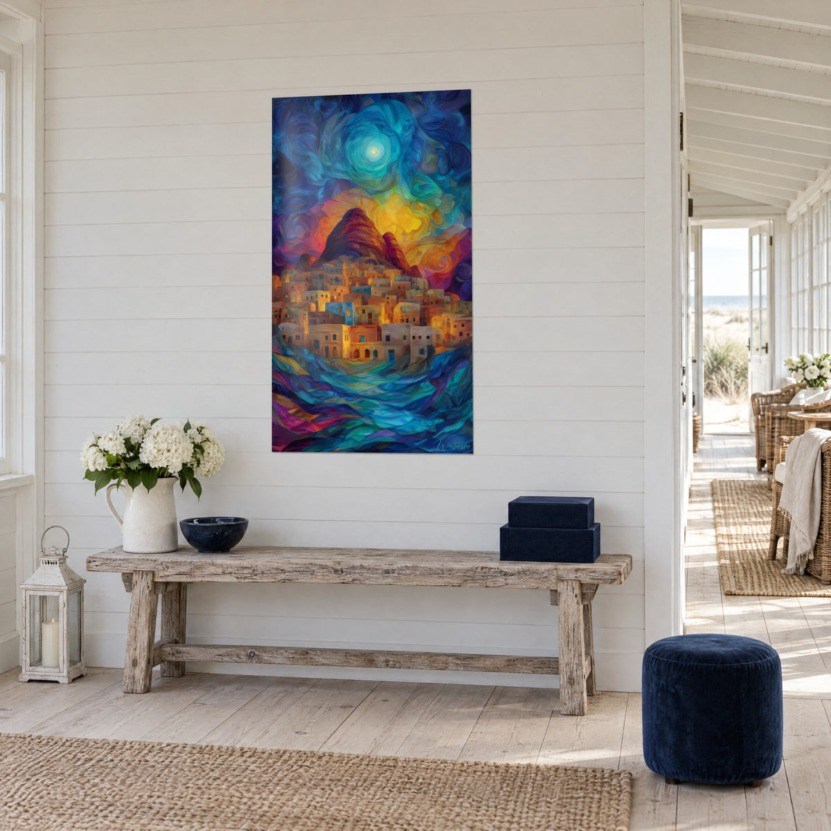 Wall art of a cave village with golden facades, purple mountain and orange sun, three-quarter view, on the white wall of a coastal house
