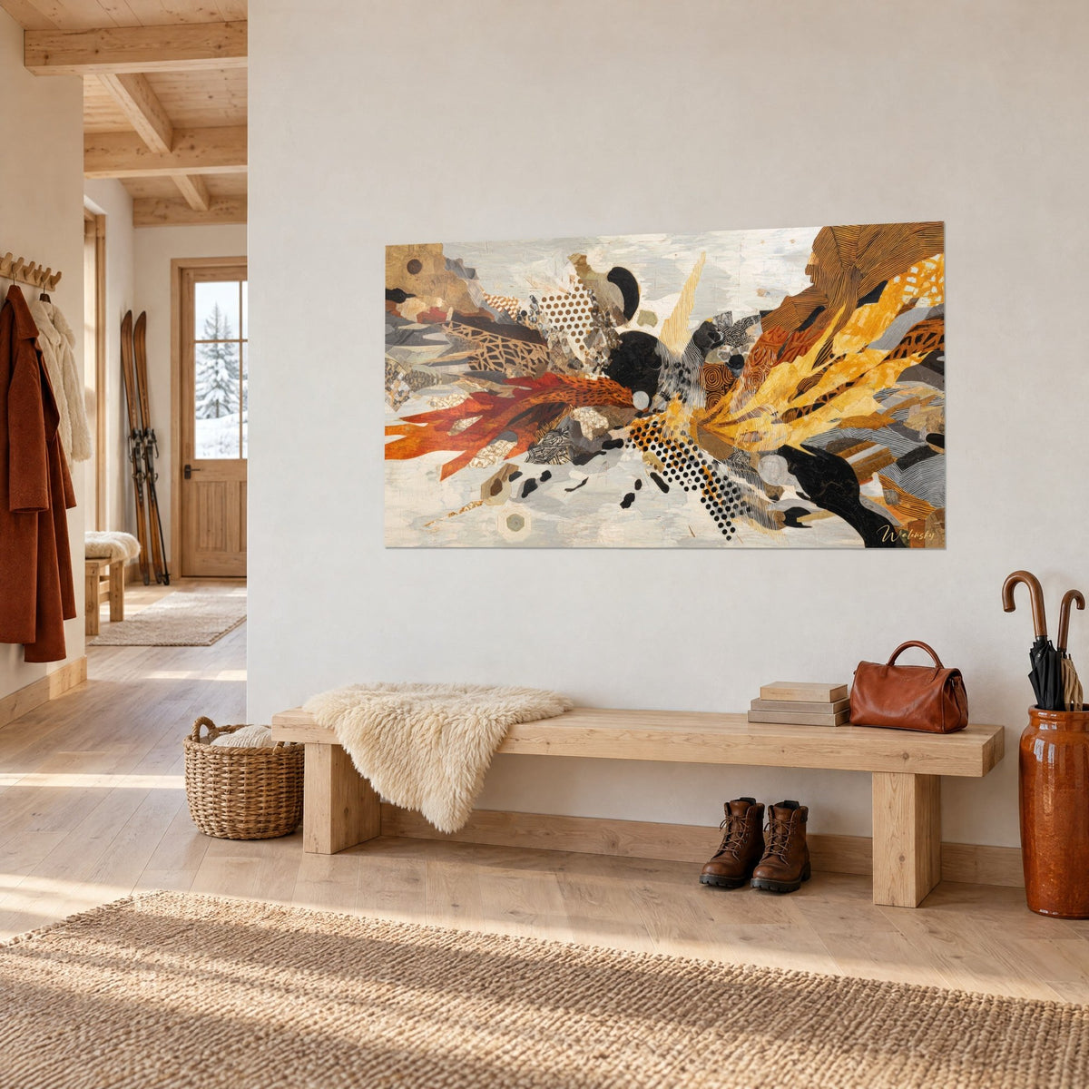 Wall art explosion of black, rust and ochre collages on a light background, hung in a light wood chalet entrance hall
