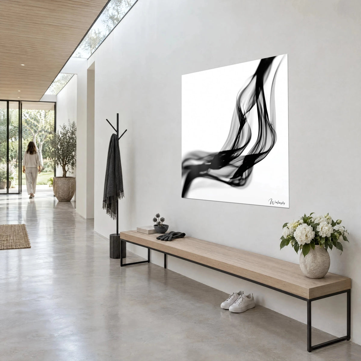 Wall art black ink ribbons floating on pure white, translucent grey ripples, hung in an architect's hallway