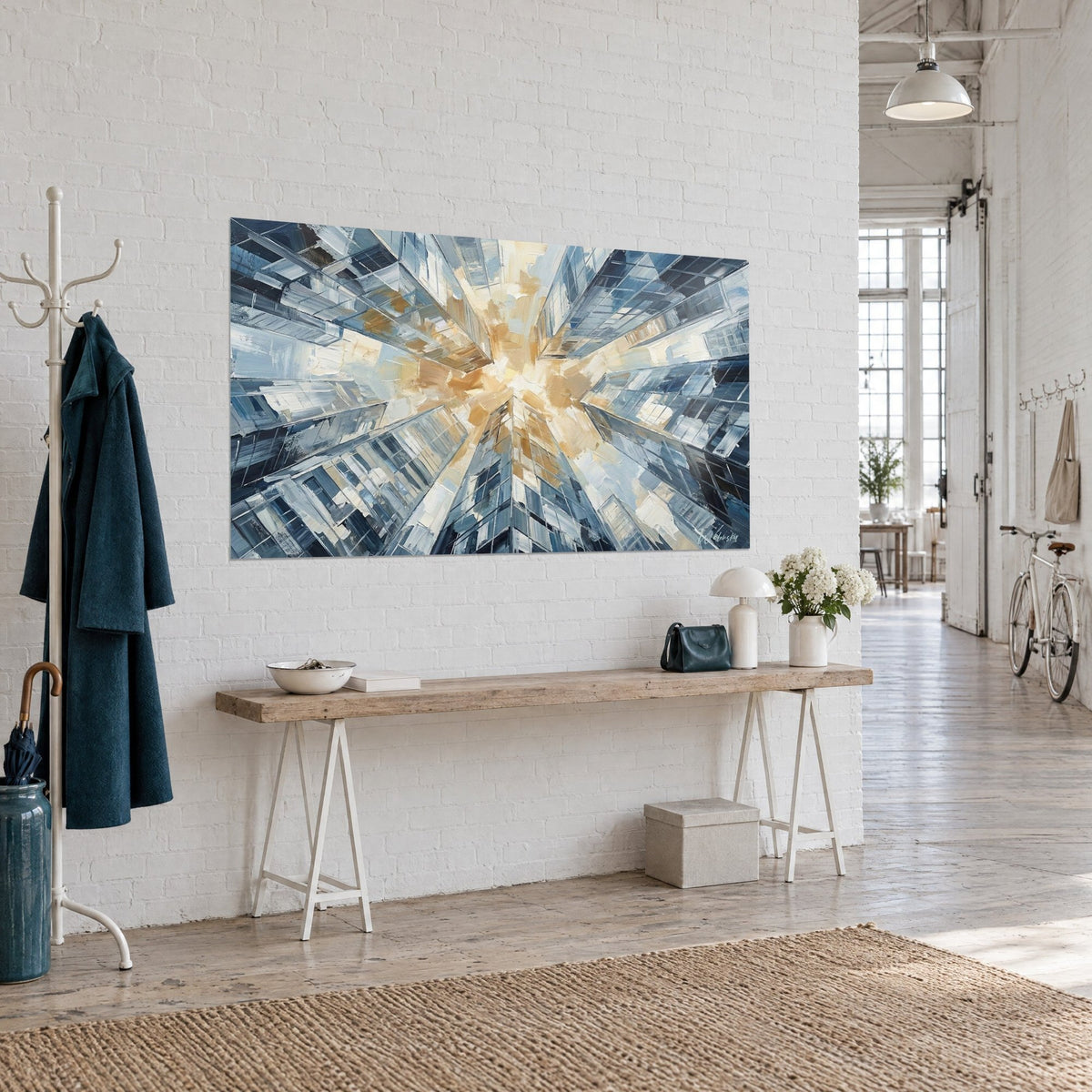 Wall art glass towers in worm's-eye view, golden and midnight-blue glow, hung on a white brick wall of a loft
