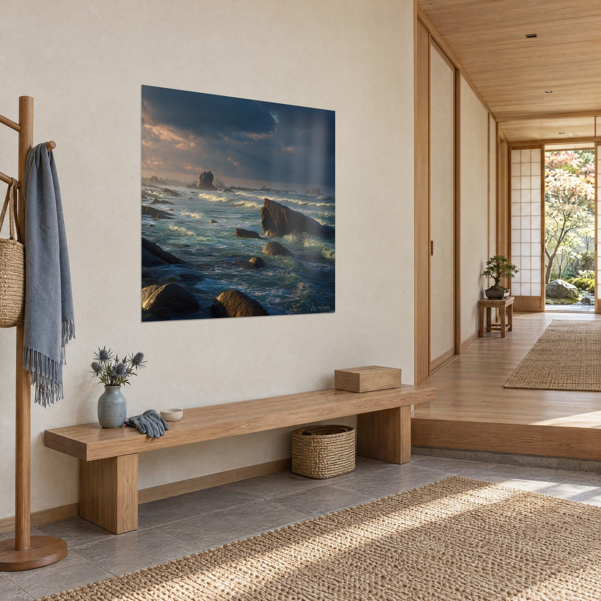 Wall art rust-coloured granite cliff battered by waves, slate sky and turquoise sea, Japandi hallway in light wood