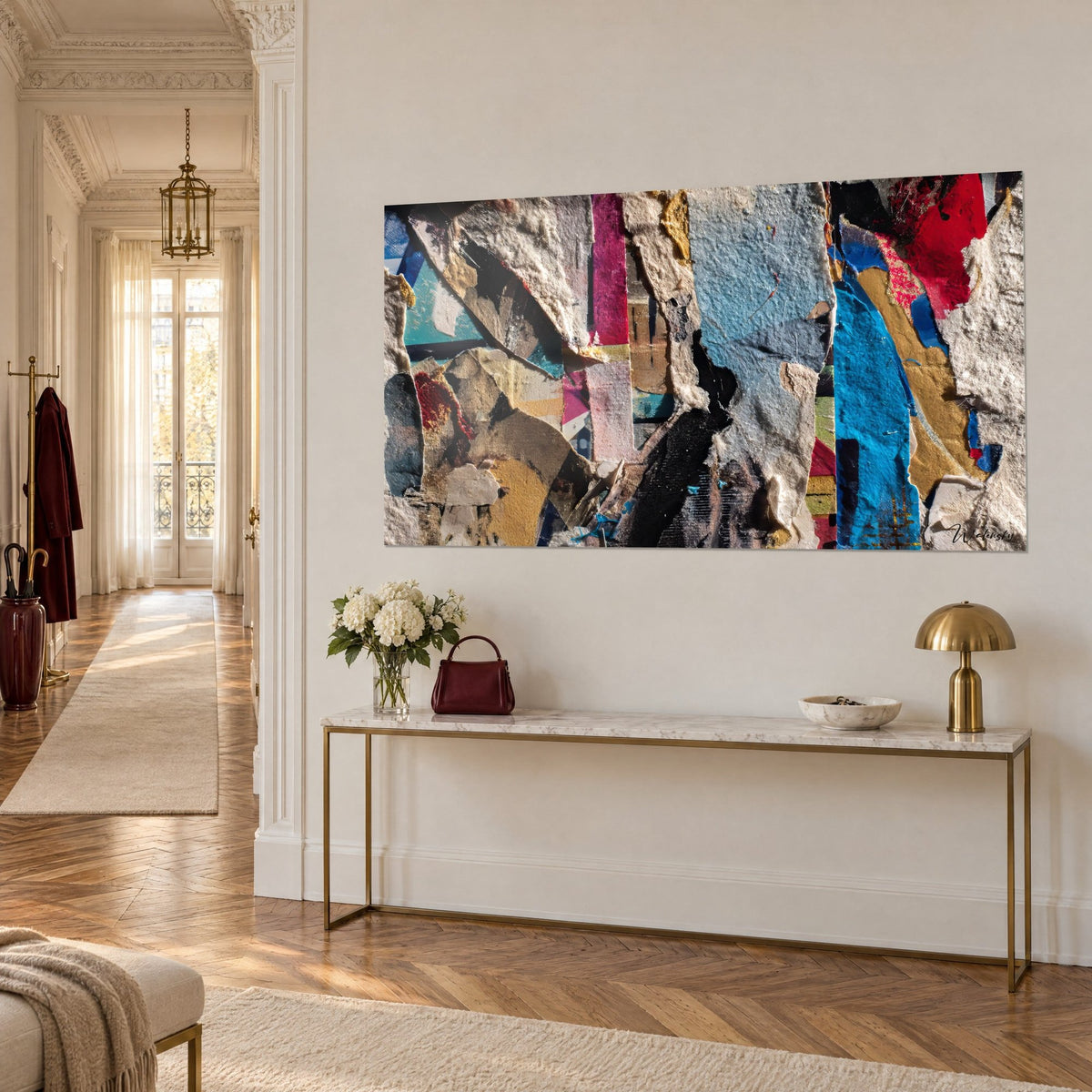 Wall art fragments of torn posters in fuchsia pink and cobalt blue, three-quarter view of a gilded console, Haussmann apartment