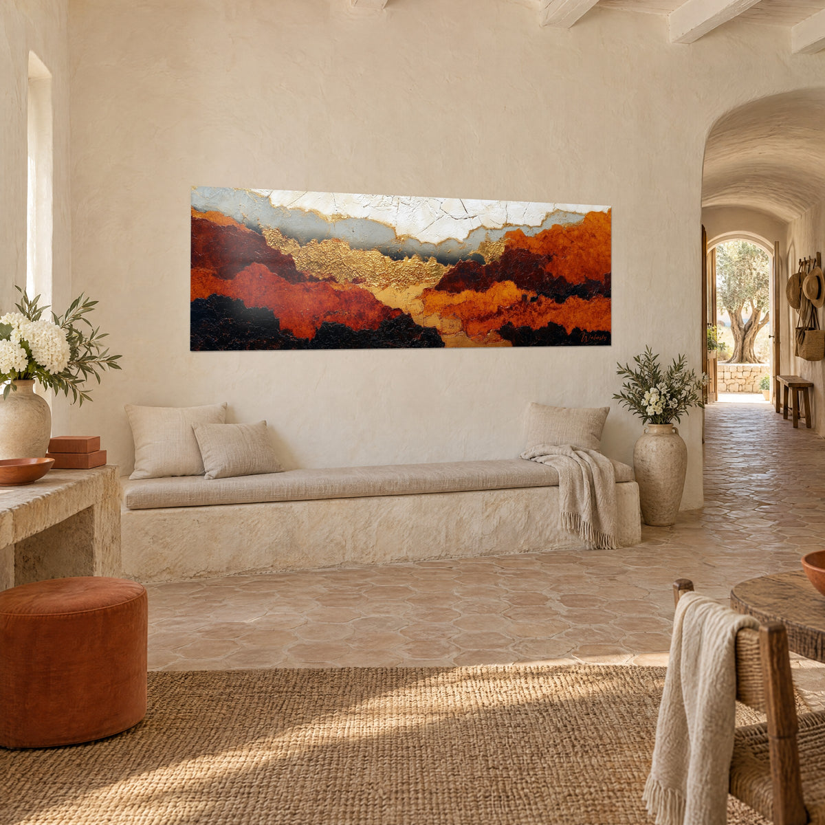 Wall art abstract landscape of rust and black hills, hammered gold leaf, seen from three-quarter view in a Provençal farmhouse