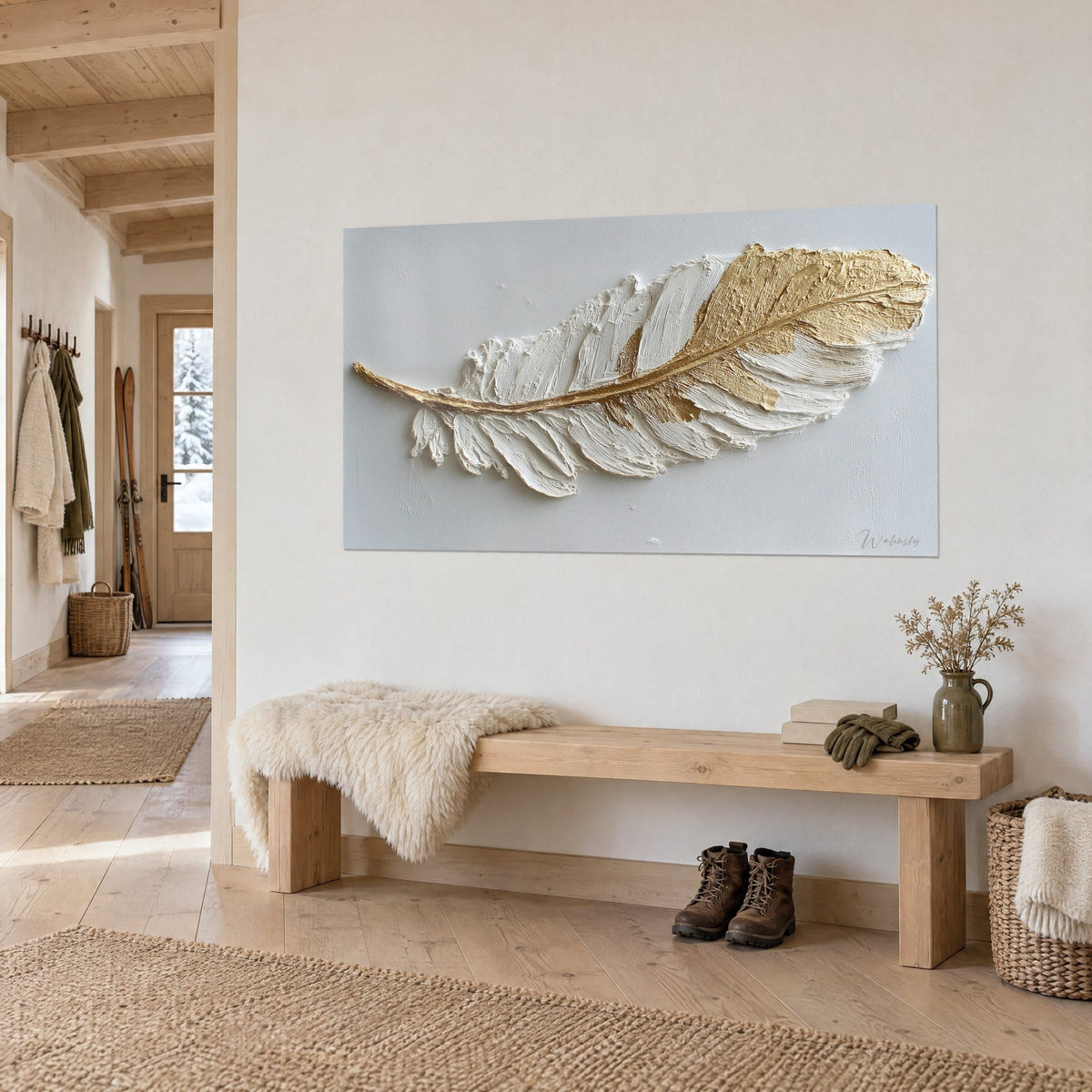 Wall art heron feather in cream paste with a raised gold ridge, on a light wall, wooden bench and chalet-style fur