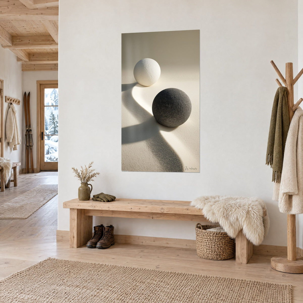Tableau galets ronds noir granuleux et blanc crème, ombre courbe sur sable doré, près d'un banc en bois, entrée de chalet