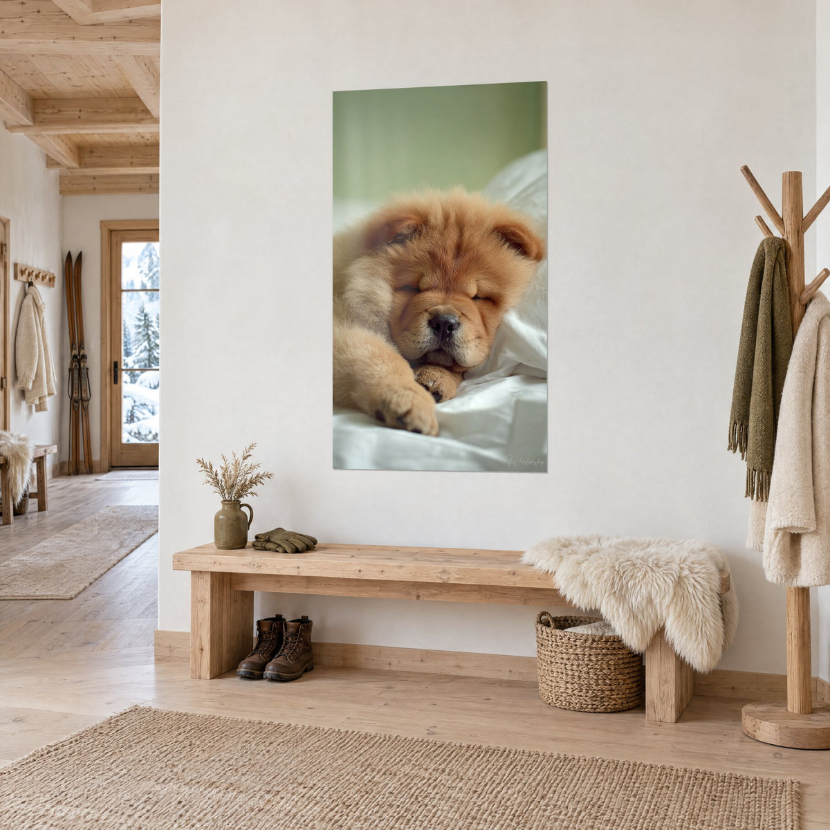 Wall art of a tawny ball of fur curled against a white pillow, soft green background, hung in the entrance of a light-wood chalet