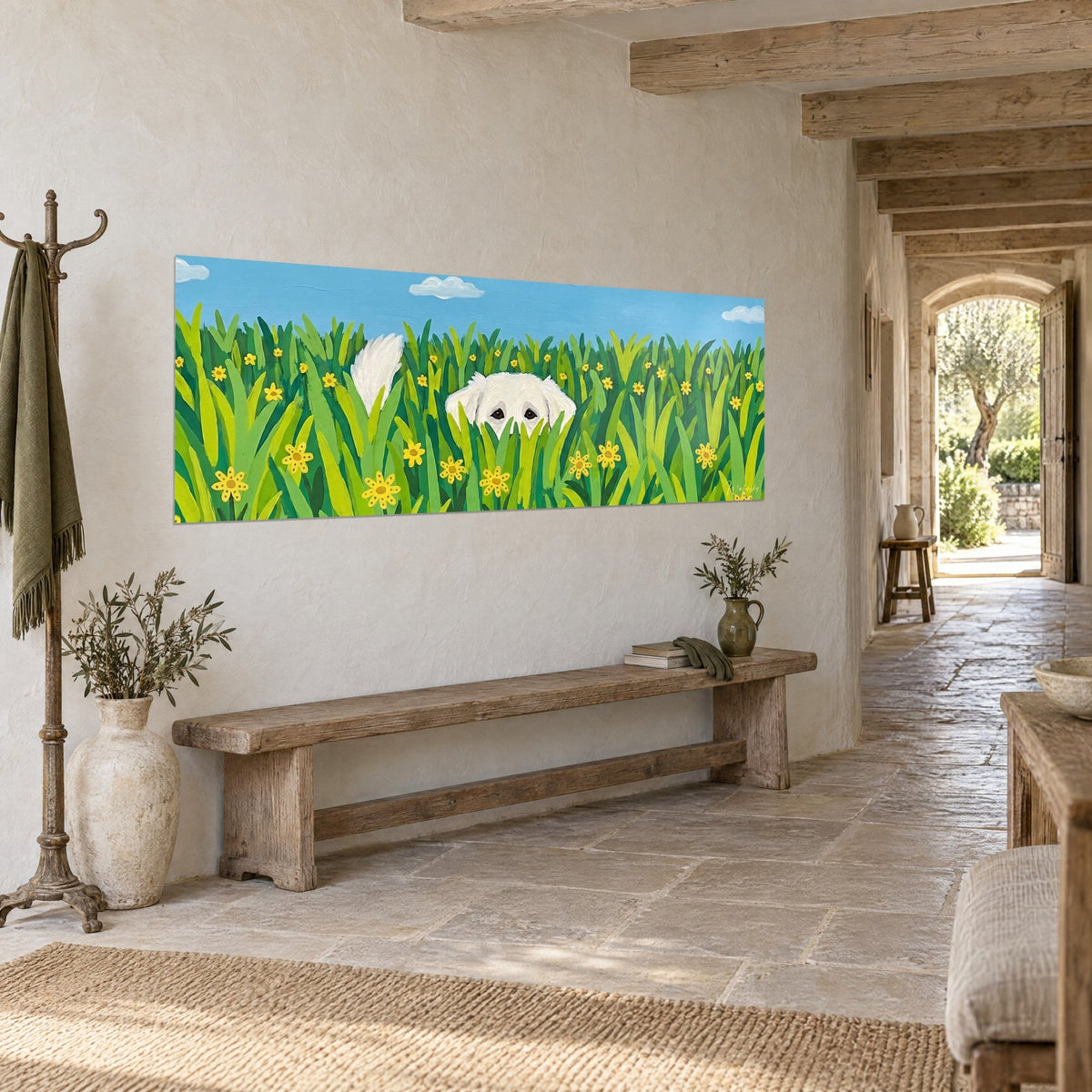 Wall art of a cream dog poking its muzzle through a green meadow dotted with yellow flowers, blue sky, wooden bench and stone wall