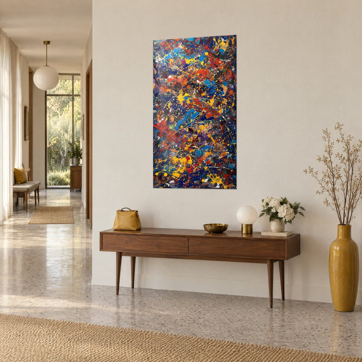 Abstract dripping wall art in brick red and midnight blue, yellow drips on a dark background, three-quarter view, bright hallway