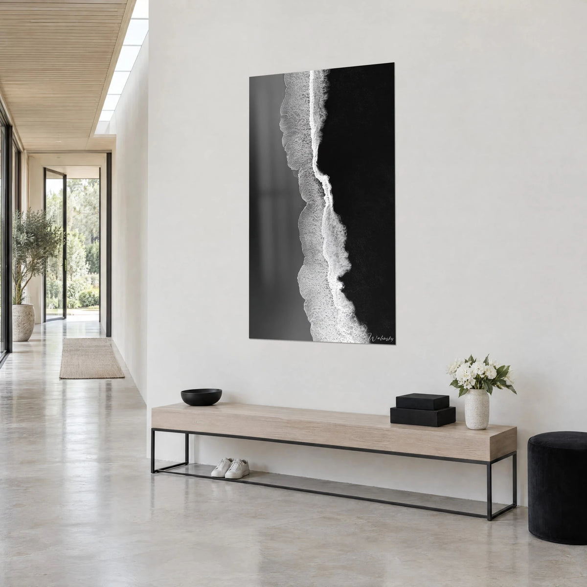 Wall art ivory foam line winding between misty grey and deep black, white wall, wooden bench, white flower bouquet